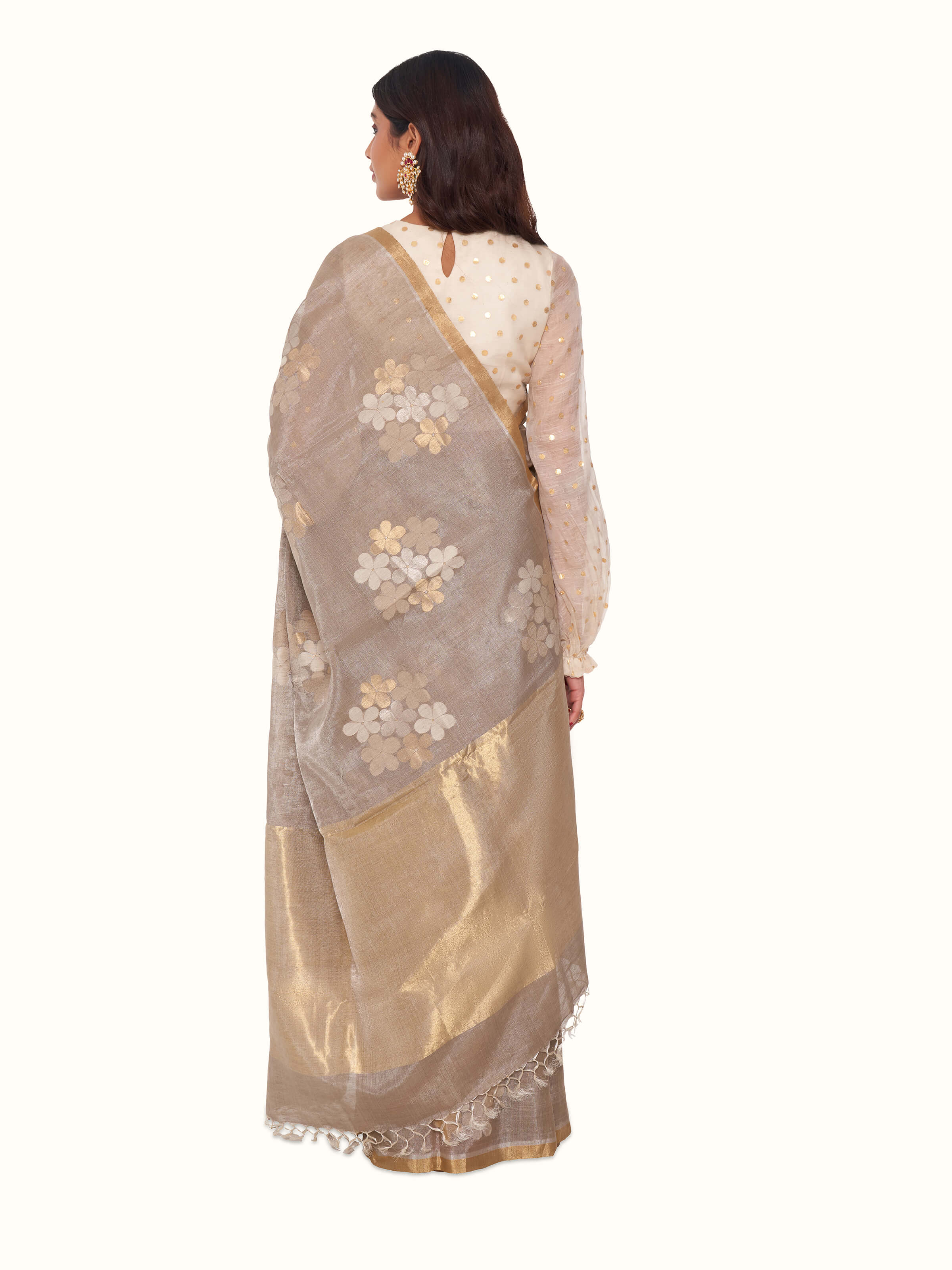 Back view of grey tussar silk saree with flowing pallu design