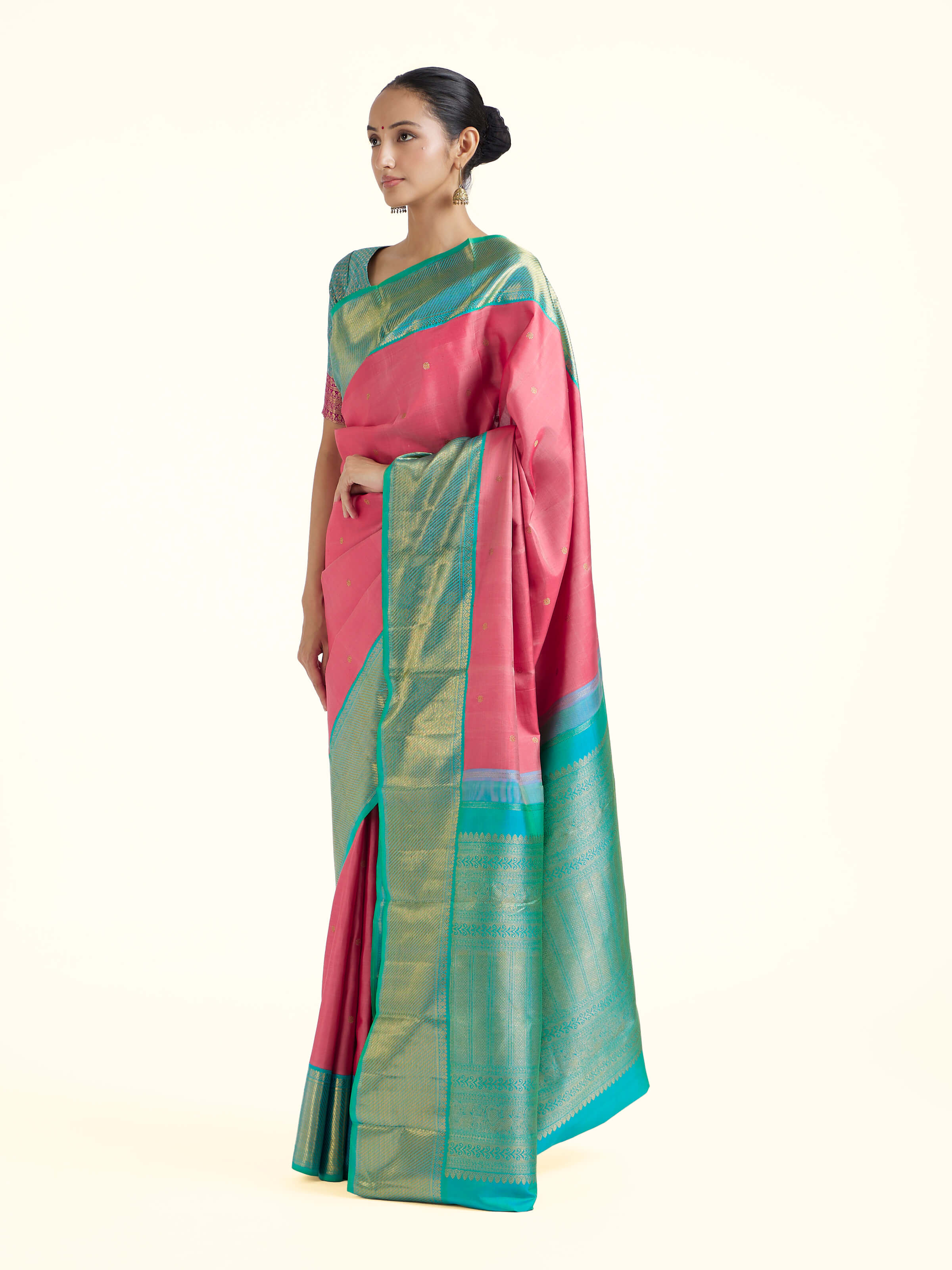 Side view of wine silk Kancheepuram saree with elegant drape and contrasting border