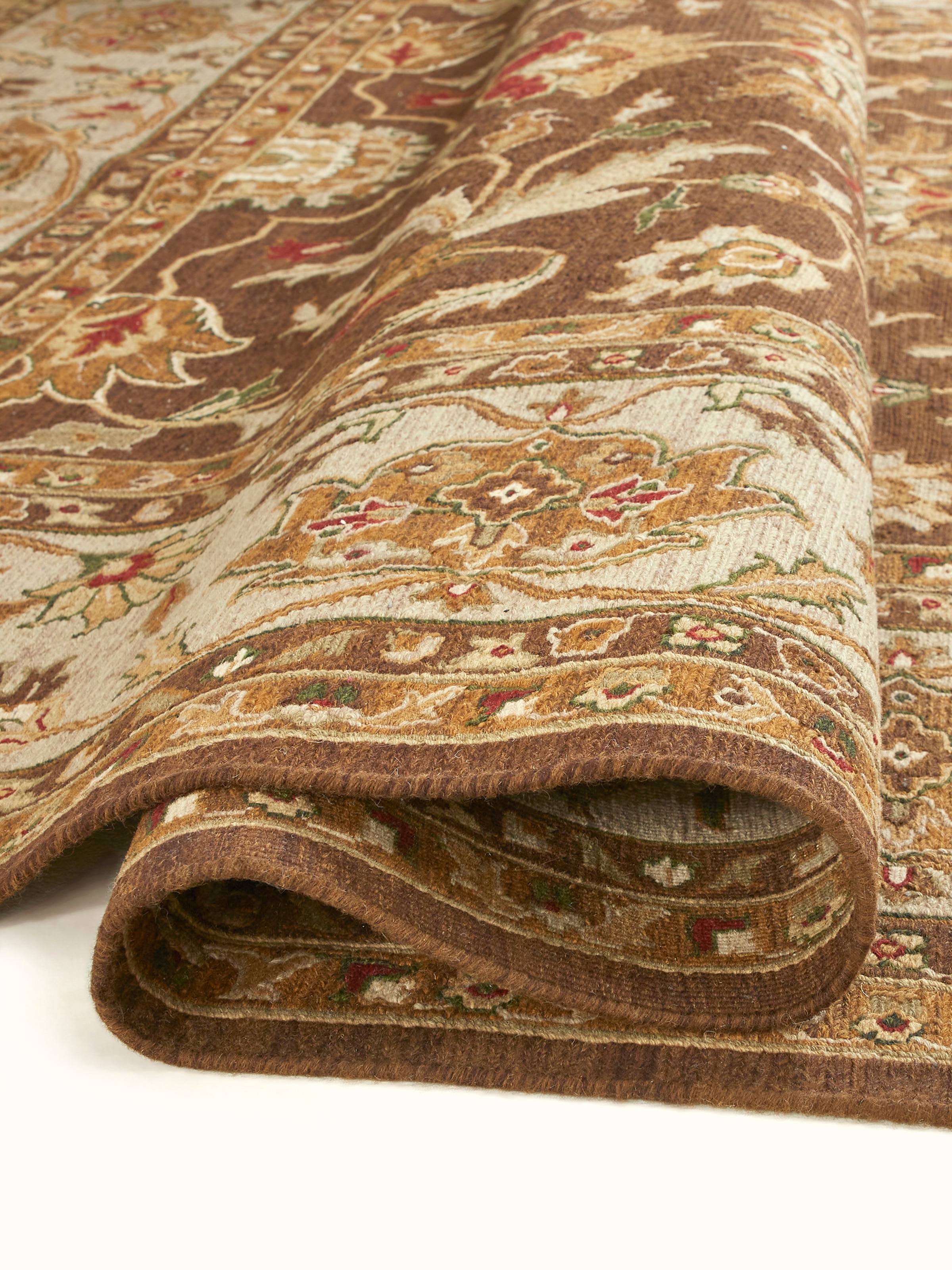 Perspective view of Traditional Sumak brown chobi Bhadohi wool hand-knotted rug emphasizing the texture and color richness.