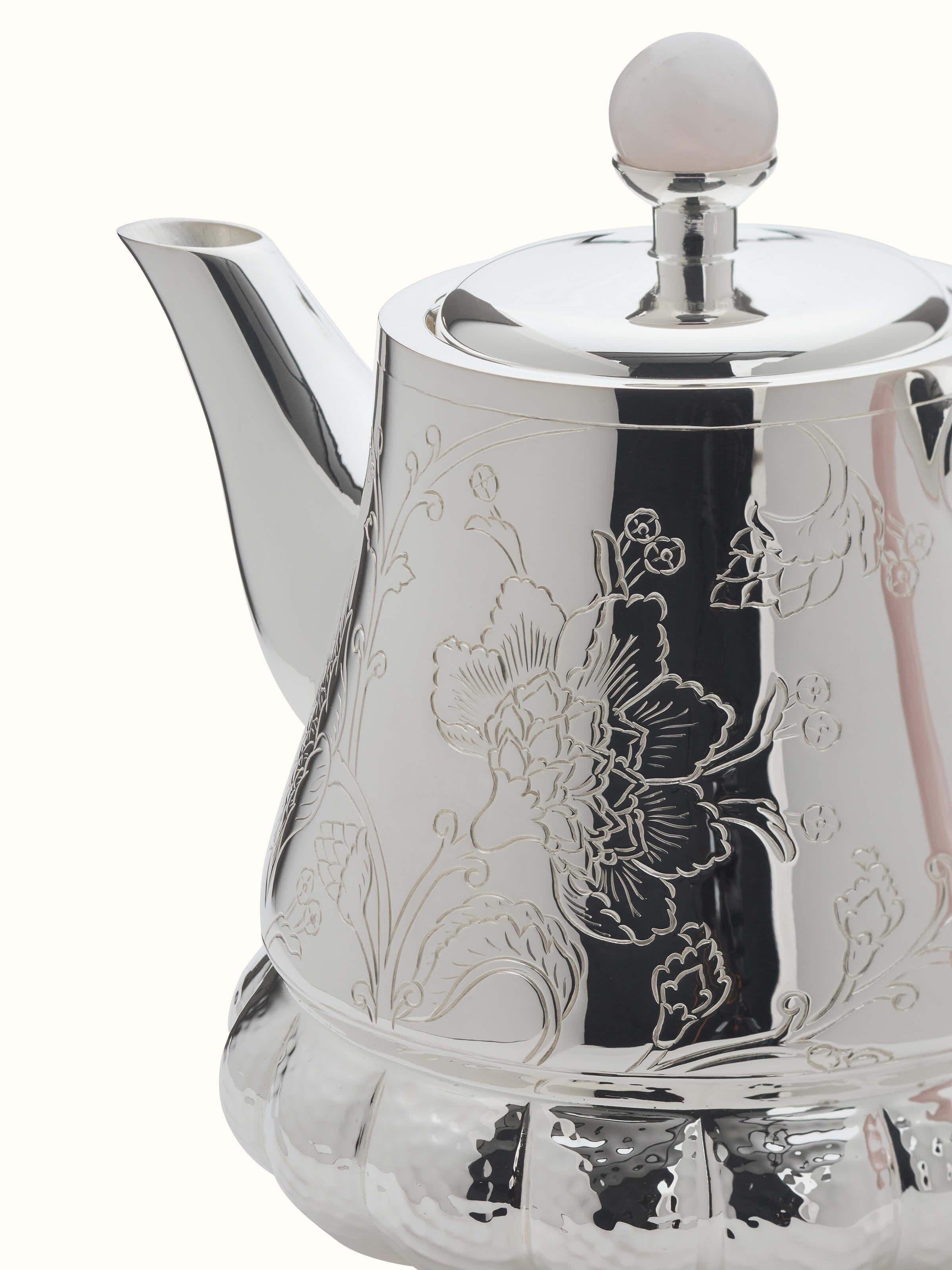 Back view of Kalamkari Silver Tea Set (3 Pcs) from Swadesh, showcasing the smooth surface and delicate artwork on the silver.