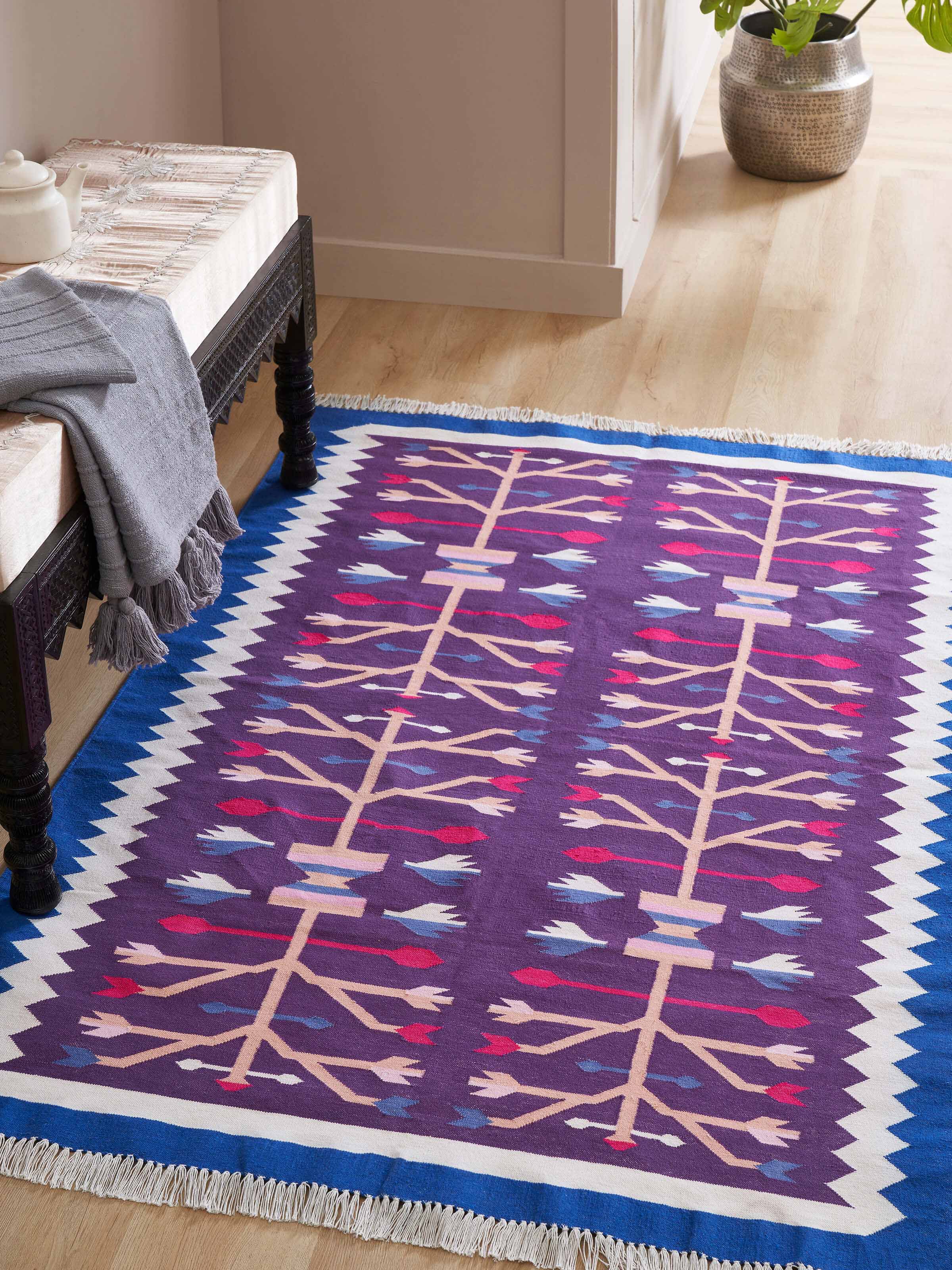 Top-down shot capturing the full pattern and color contrast of the dhurrie