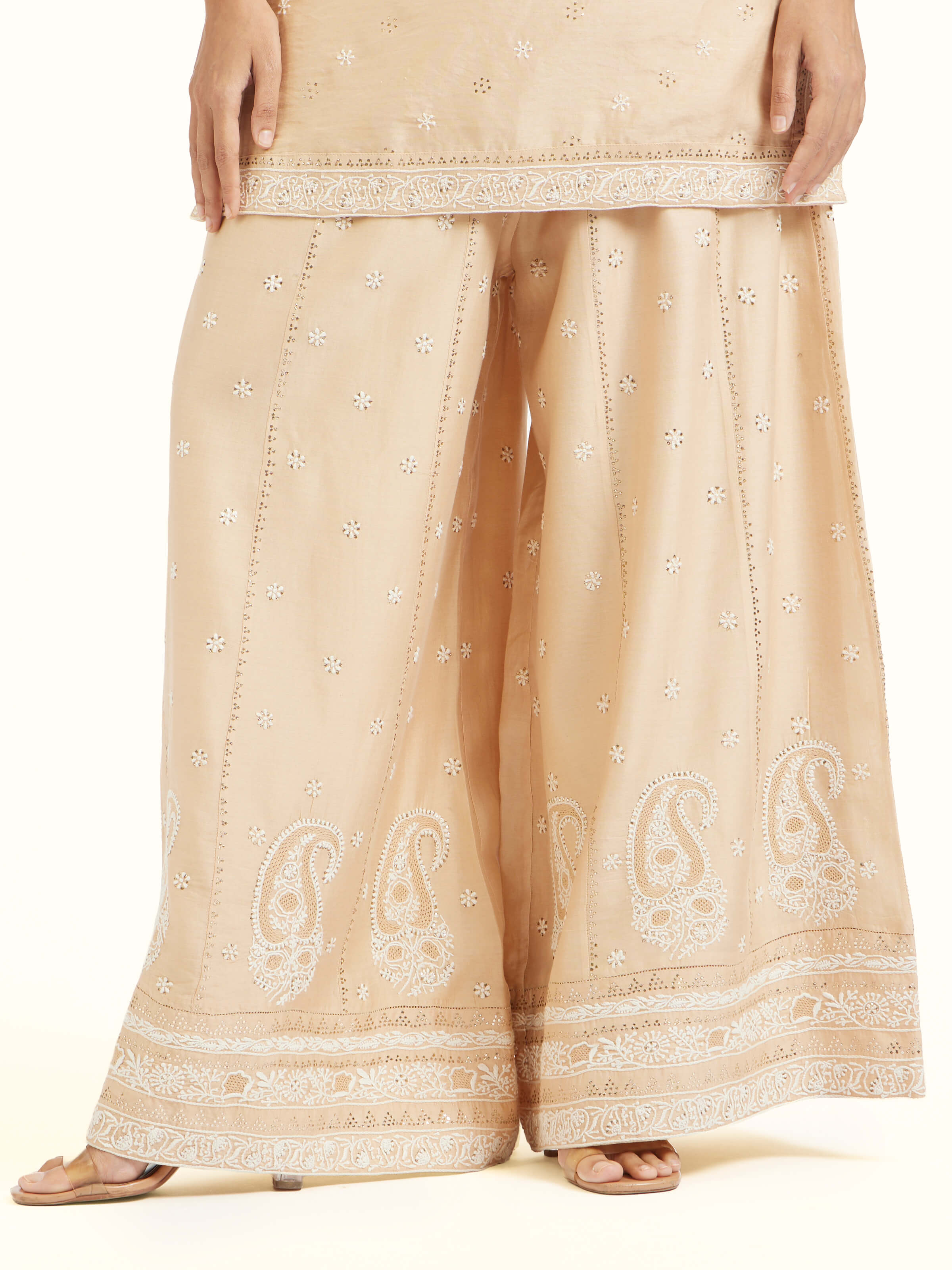 Detail view of beige silk Chanderi kalidar sharara showing fabric texture