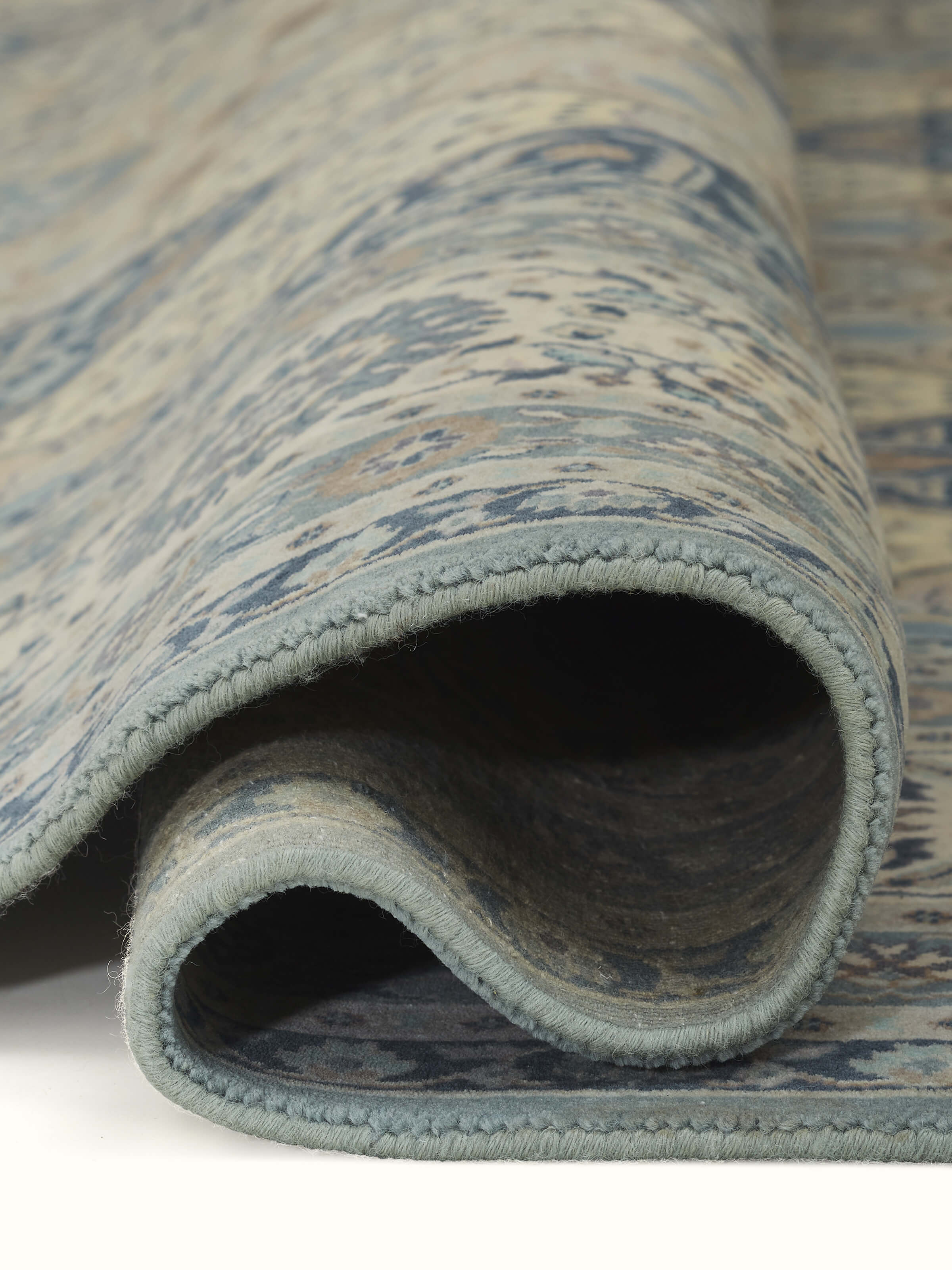 Texture detail showing wool weave and subtle color gradients in Sarouk rug