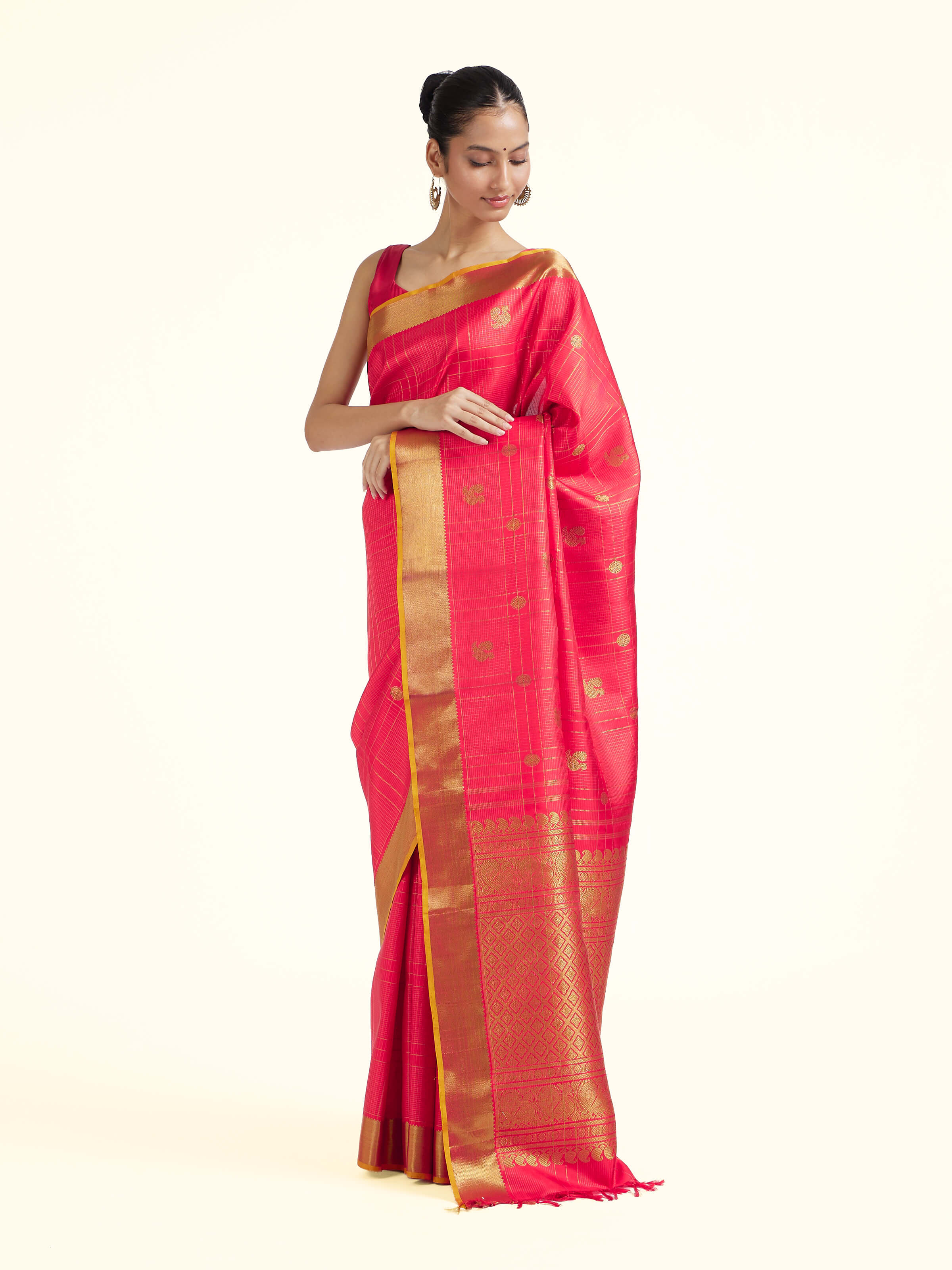 Side view of red silk Kancheepuram saree with graceful drape and contrast border