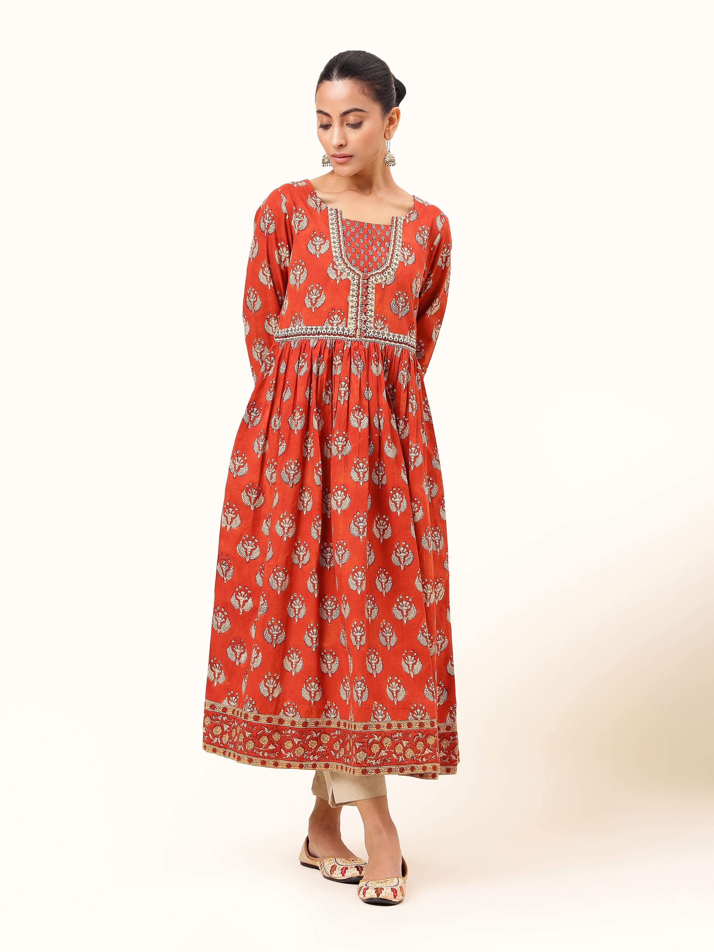 Front view of red cotton Bagru block printed kurta with intricate neckline detail
