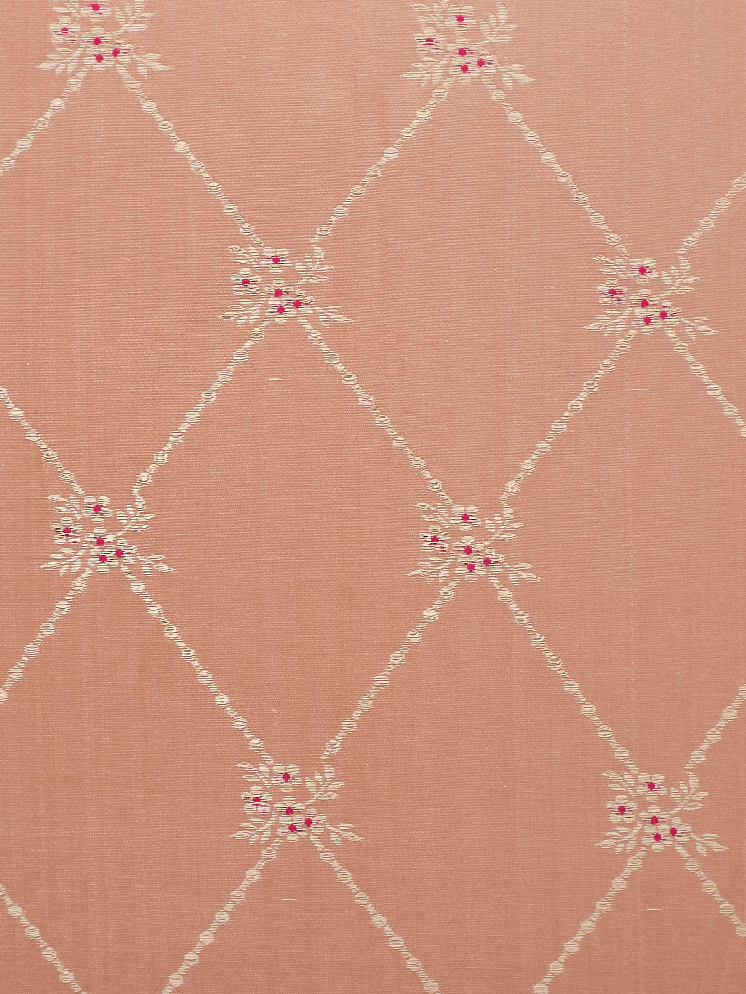 Detail shot of gold zari floral design on Awadh peach Banarasi cushion cover.