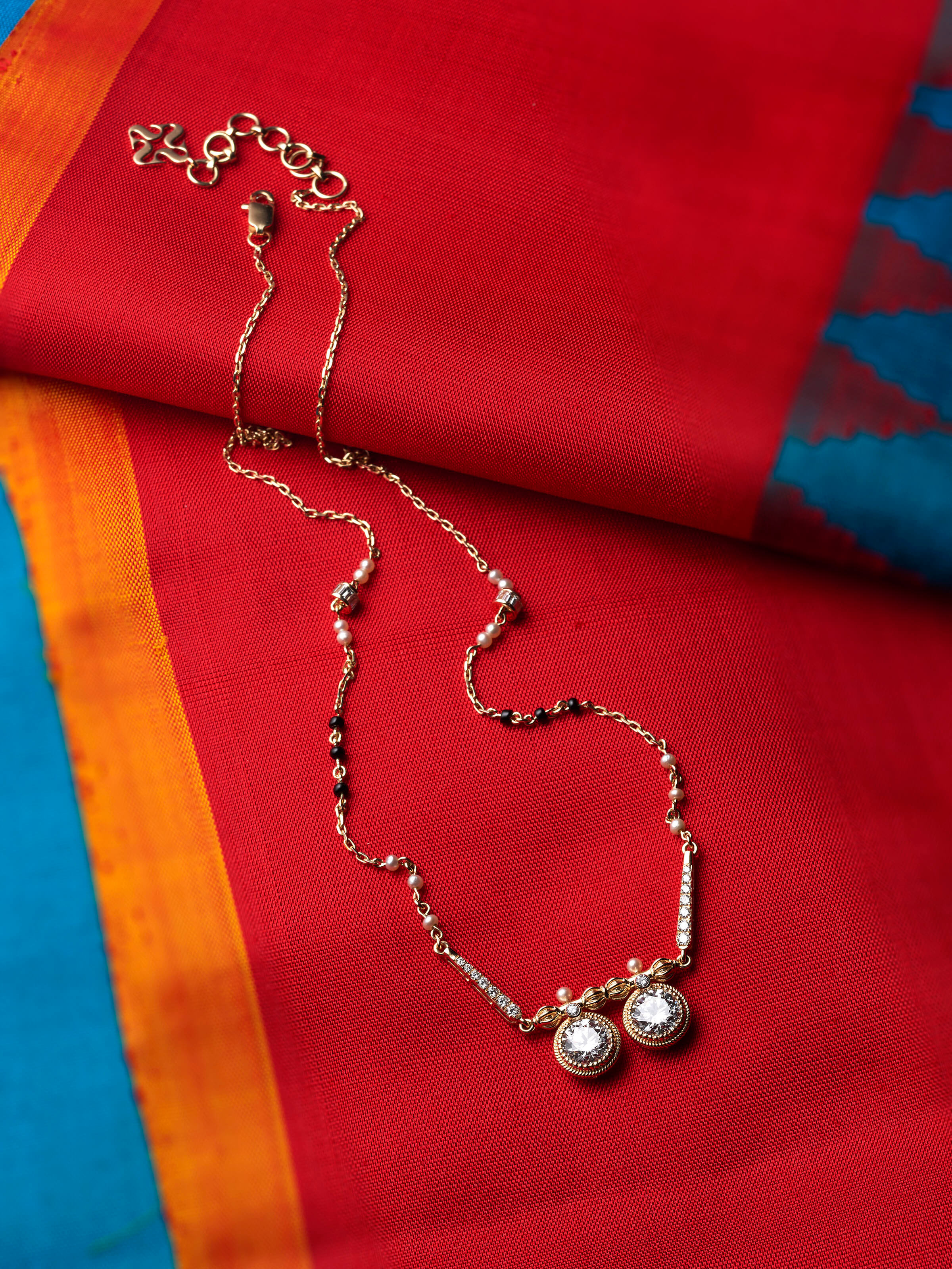 lifestyle view of open setting 14 karat gold mangalsutra