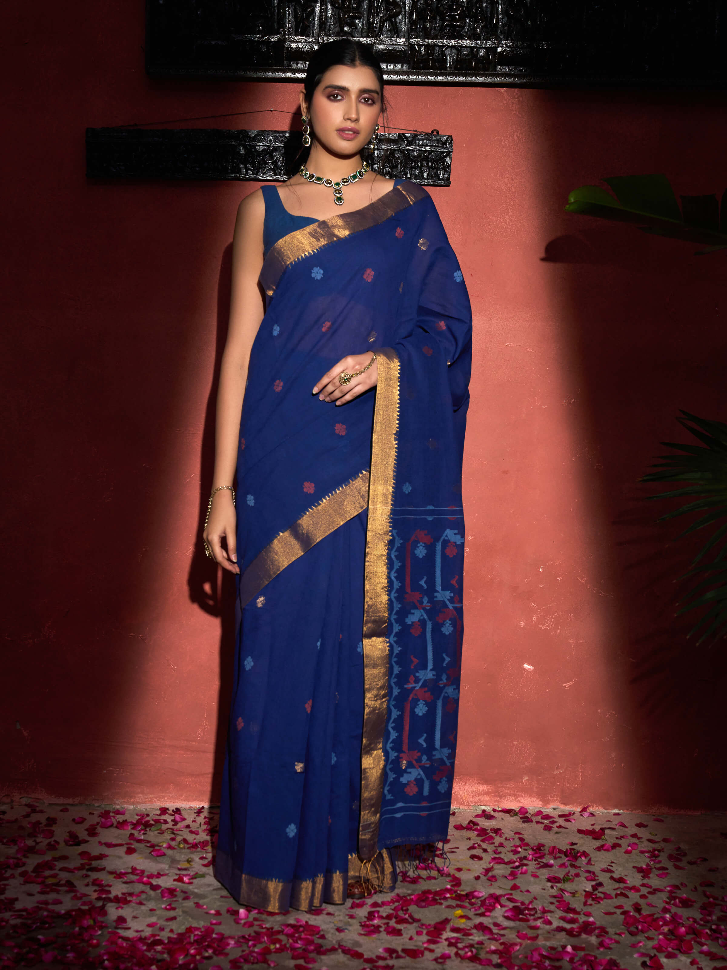 Side view of blue muslin Jamdani saree highlighting soft drape