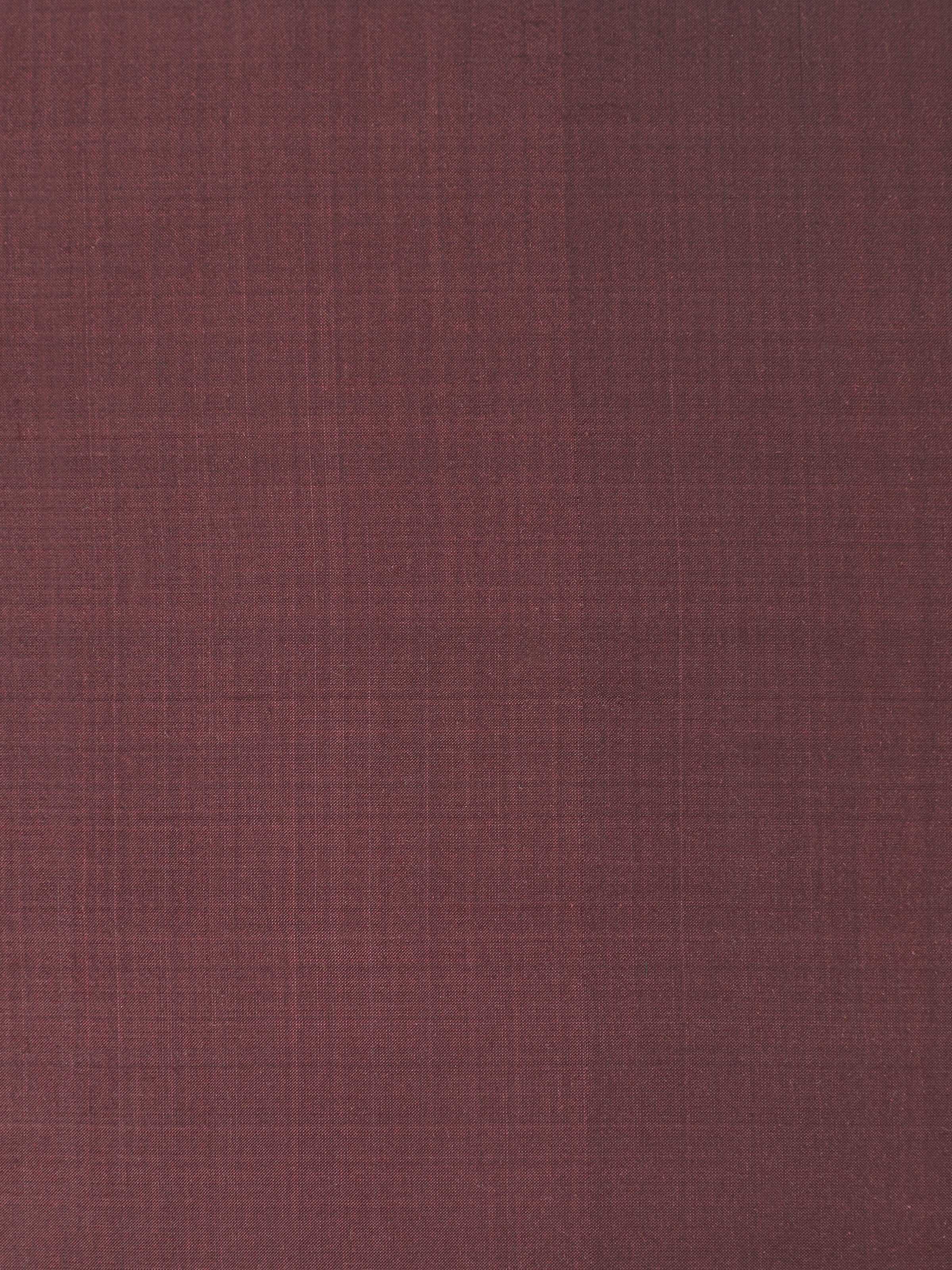 Detailed side view showing fabric texture and fine Ikat weave in deep brown.