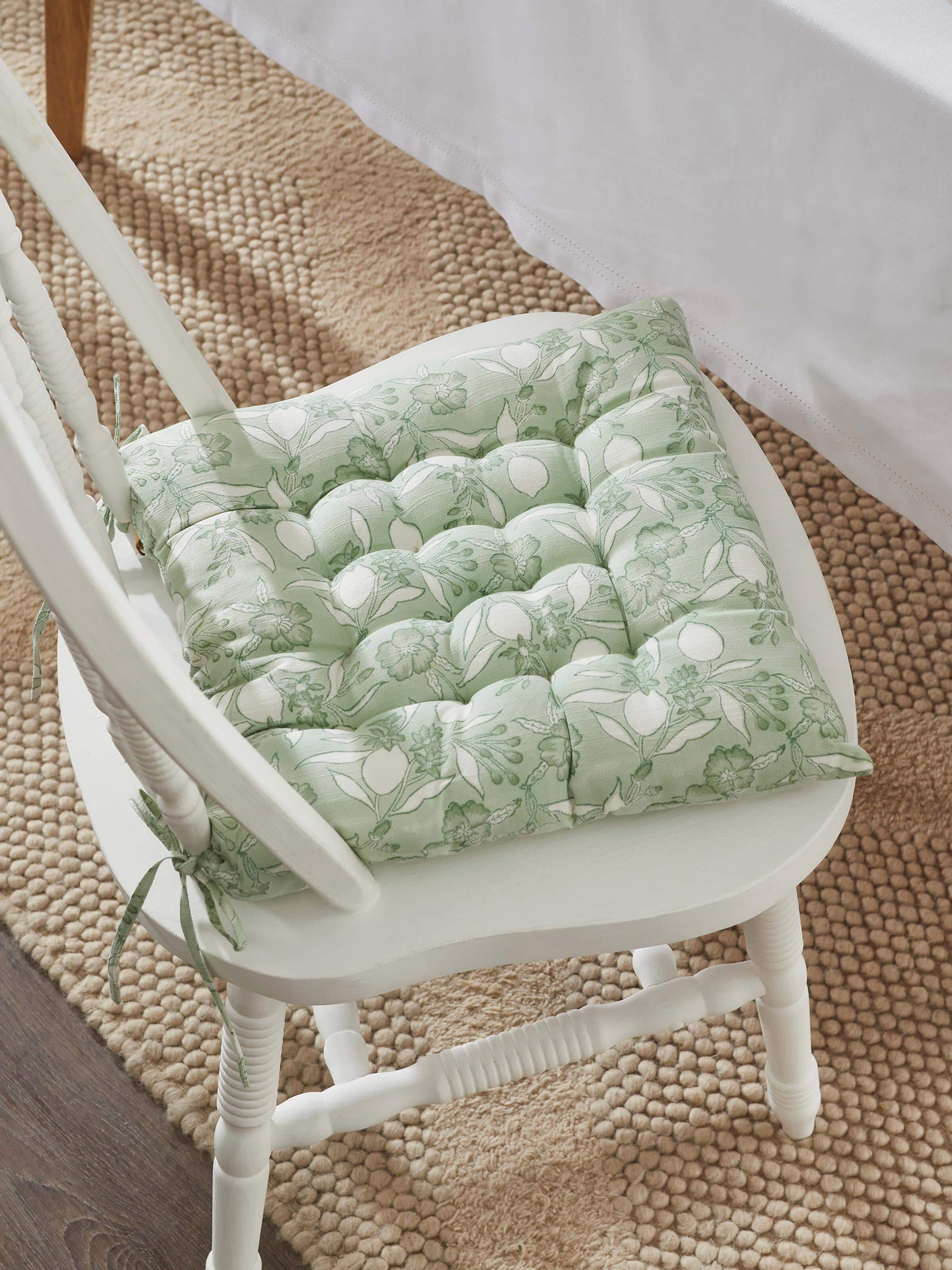 Top view displaying the full cushion with vibrant floral patterns and neat edges