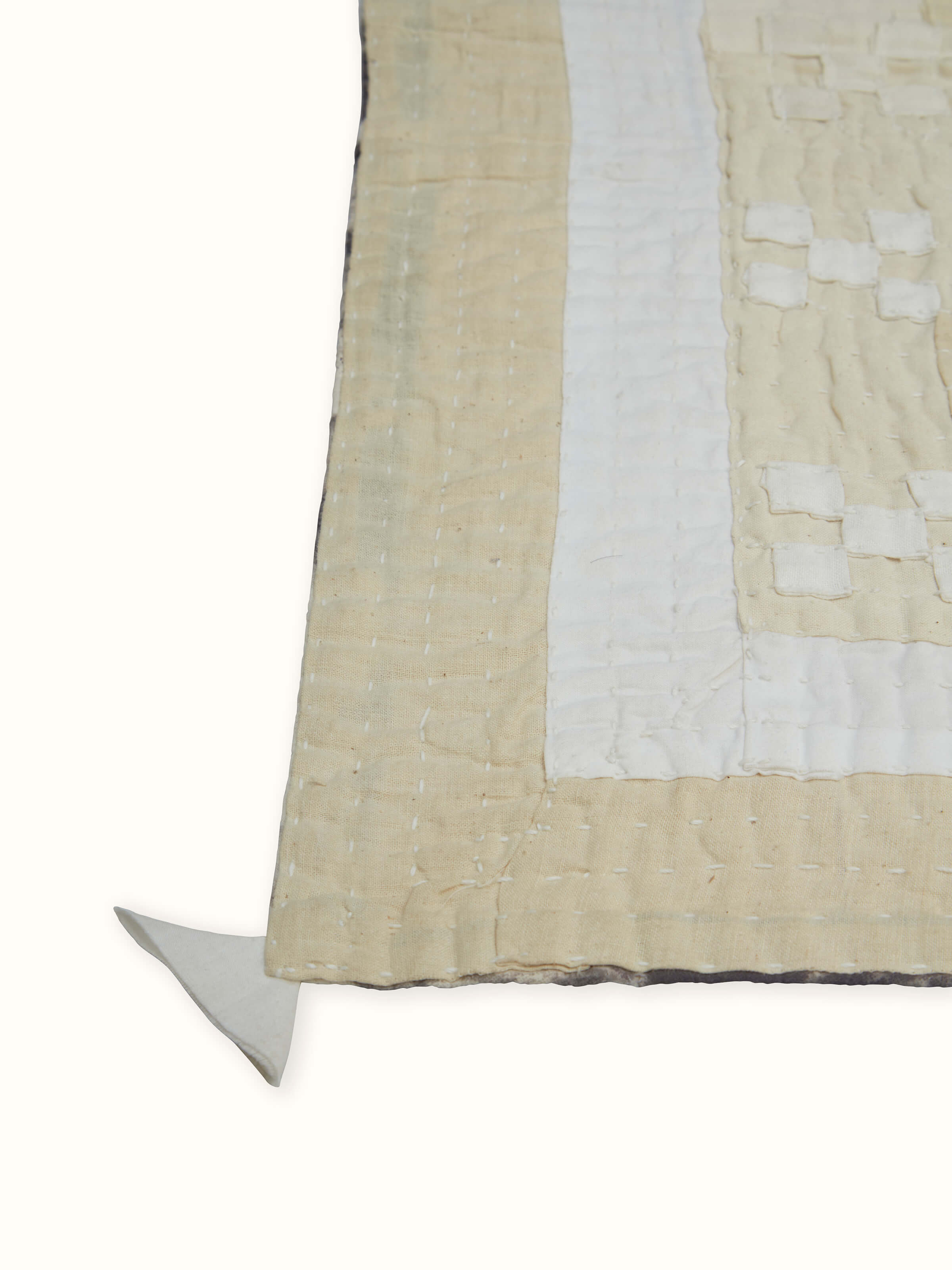 Close-up of abstract patchwork design on Siddi single bedspread