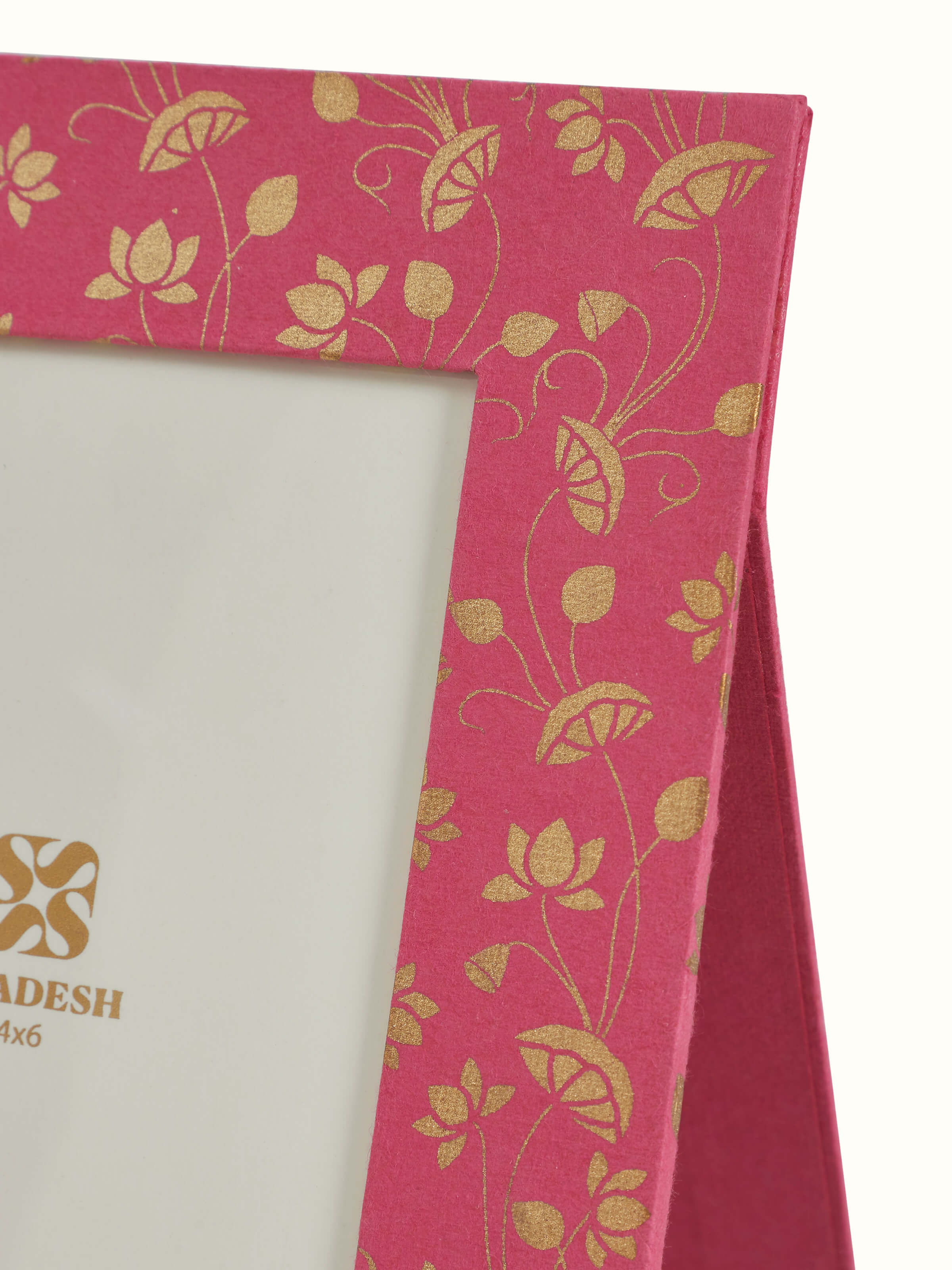 Detail close-up of handmade paper photo frame showing surface texture