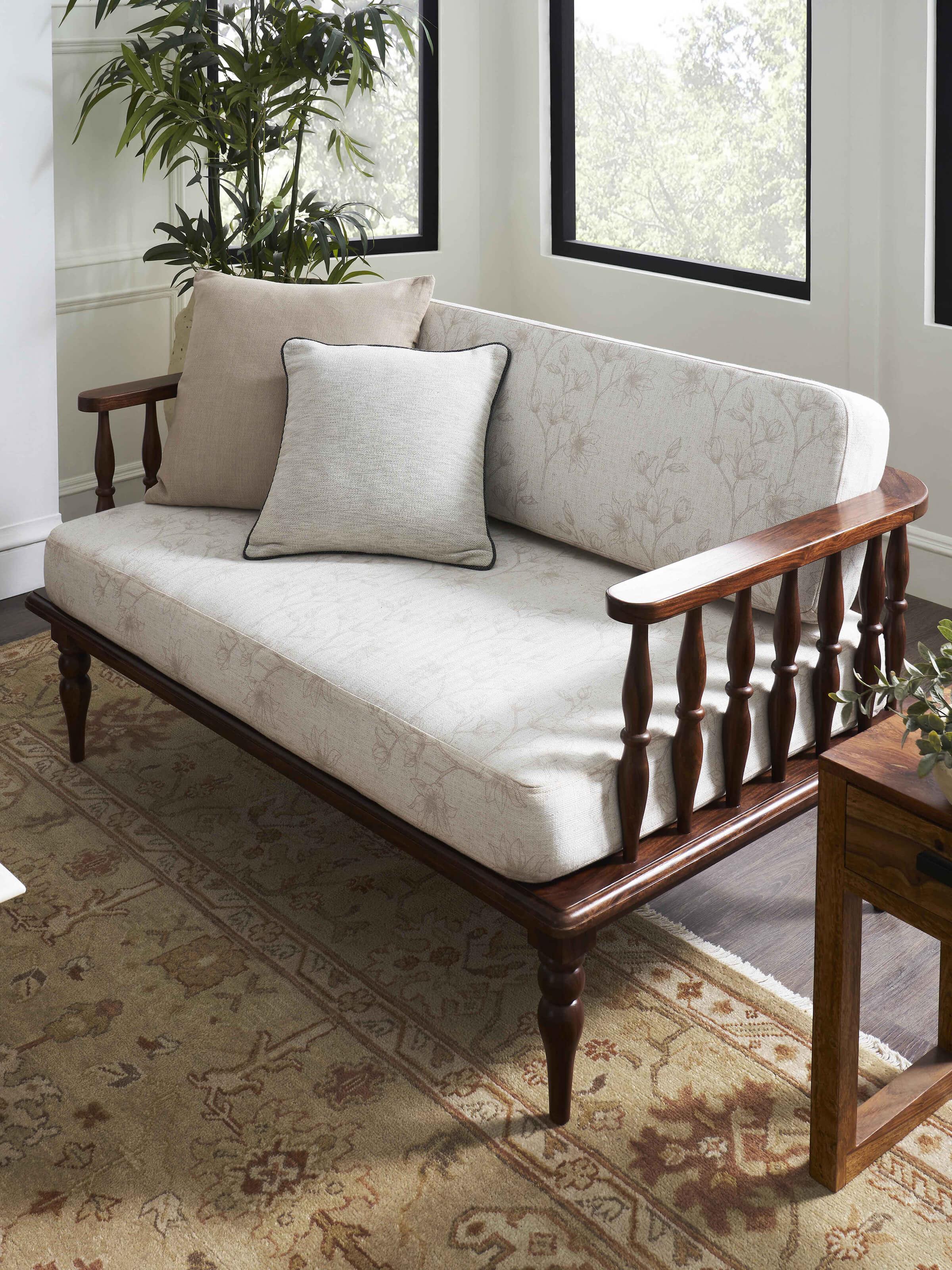 Side view of Teak Finish Upholstered Sheesham Wood 2-seater Sofa, showcasing its elegant design and plush upholstery.