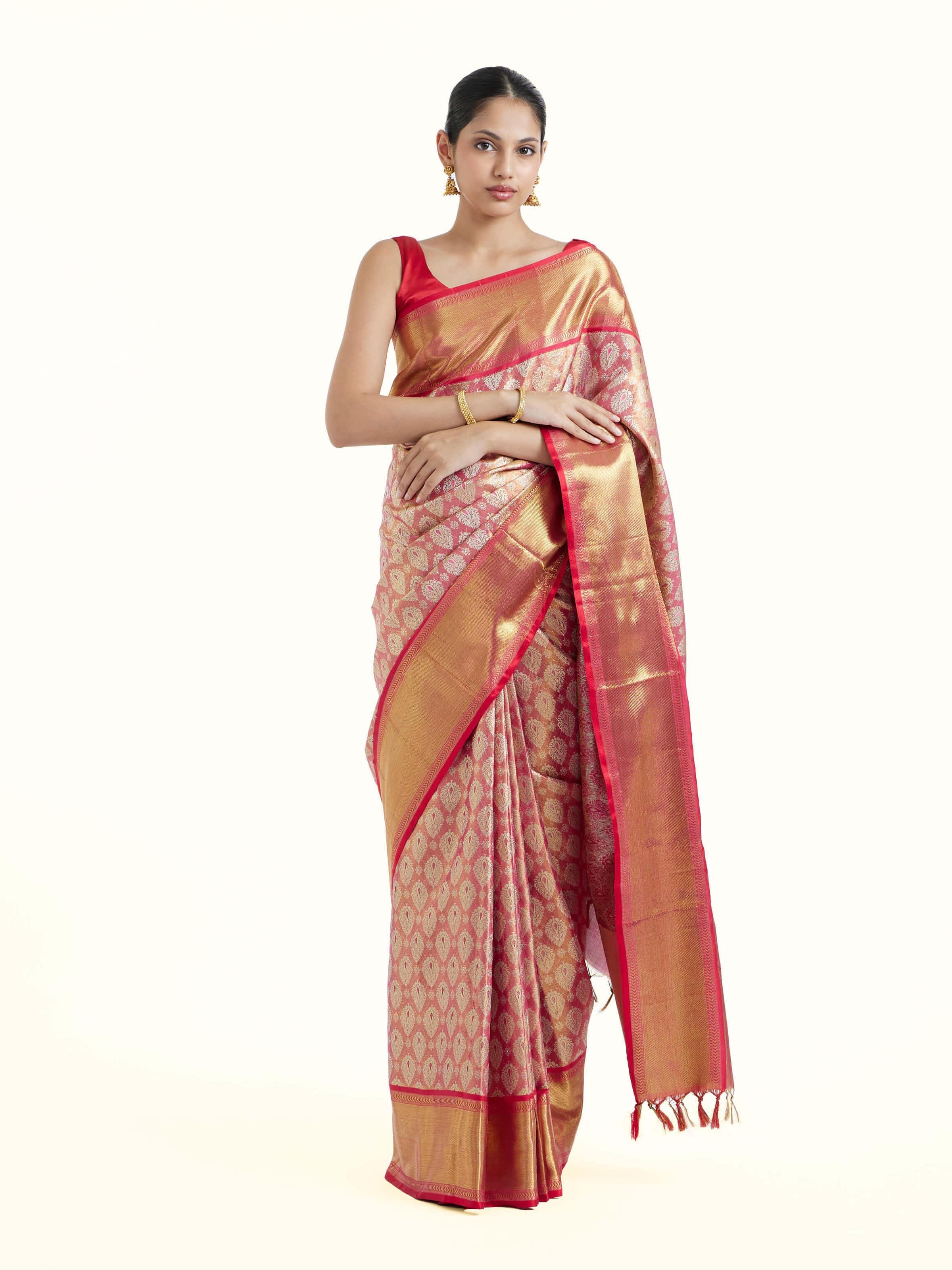 Front view of pink silk Kancheepuram saree with rich zari woven motifs