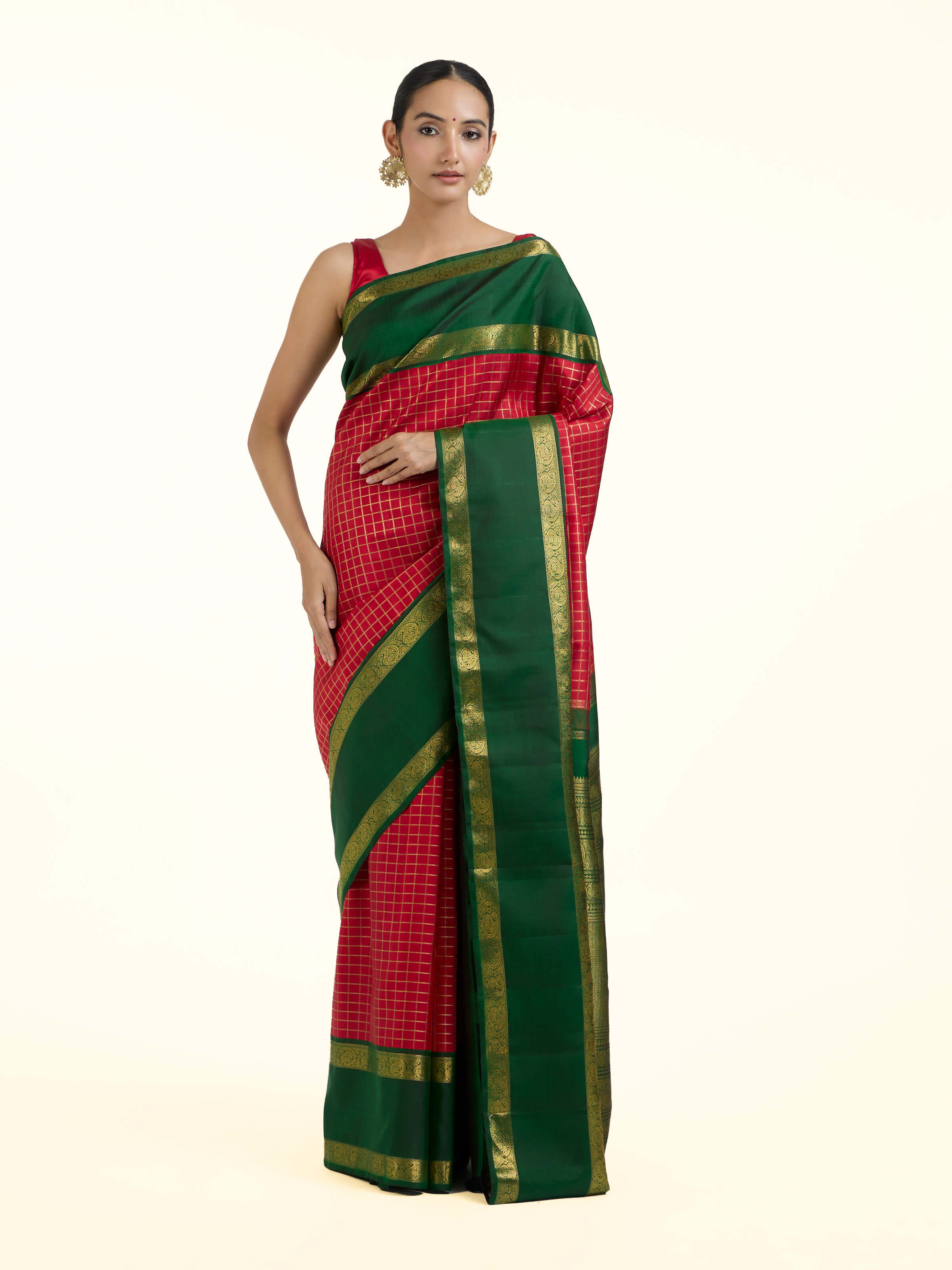 Front view of green silk Kancheepuram saree with rich zari motifs
