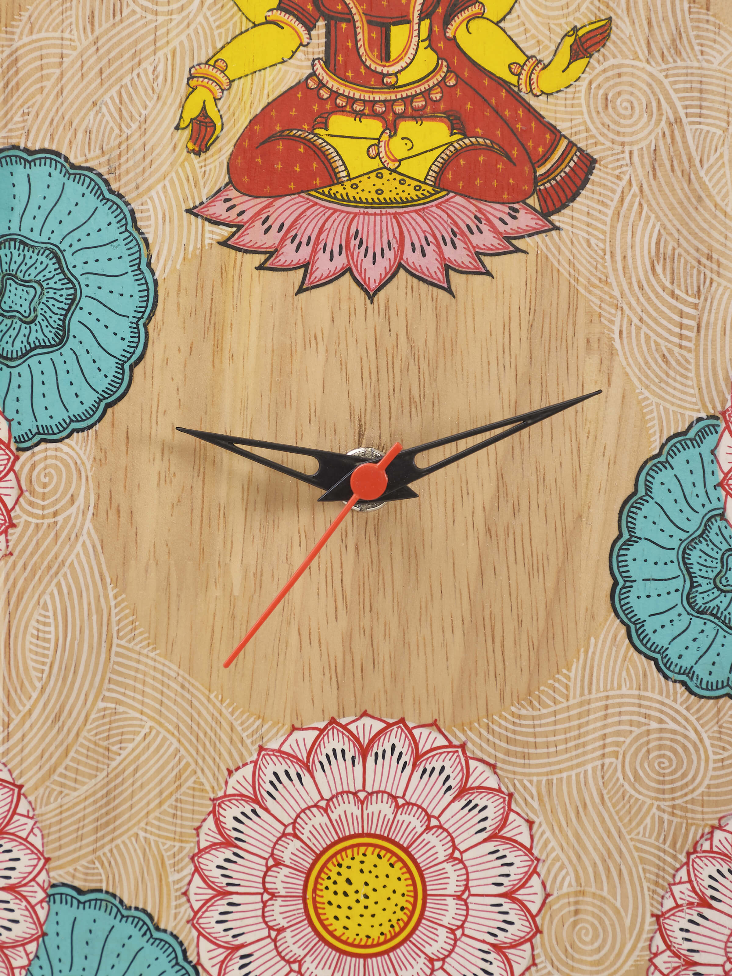 Detail shot of painted Pattachitra Lakshmi wooden wall clock highlighting hand painting