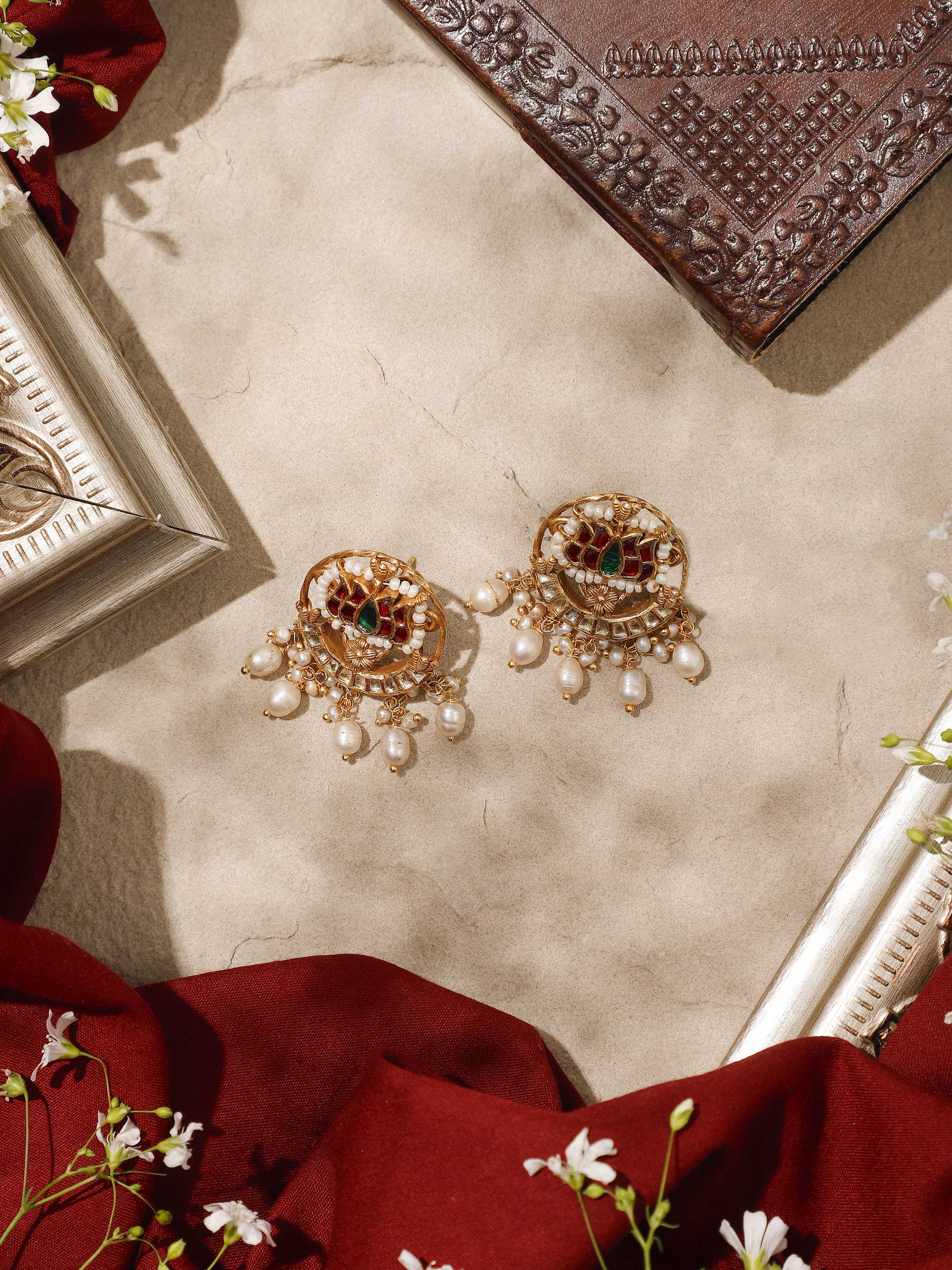 Angled image capturing the graceful curve and shine of the earrings