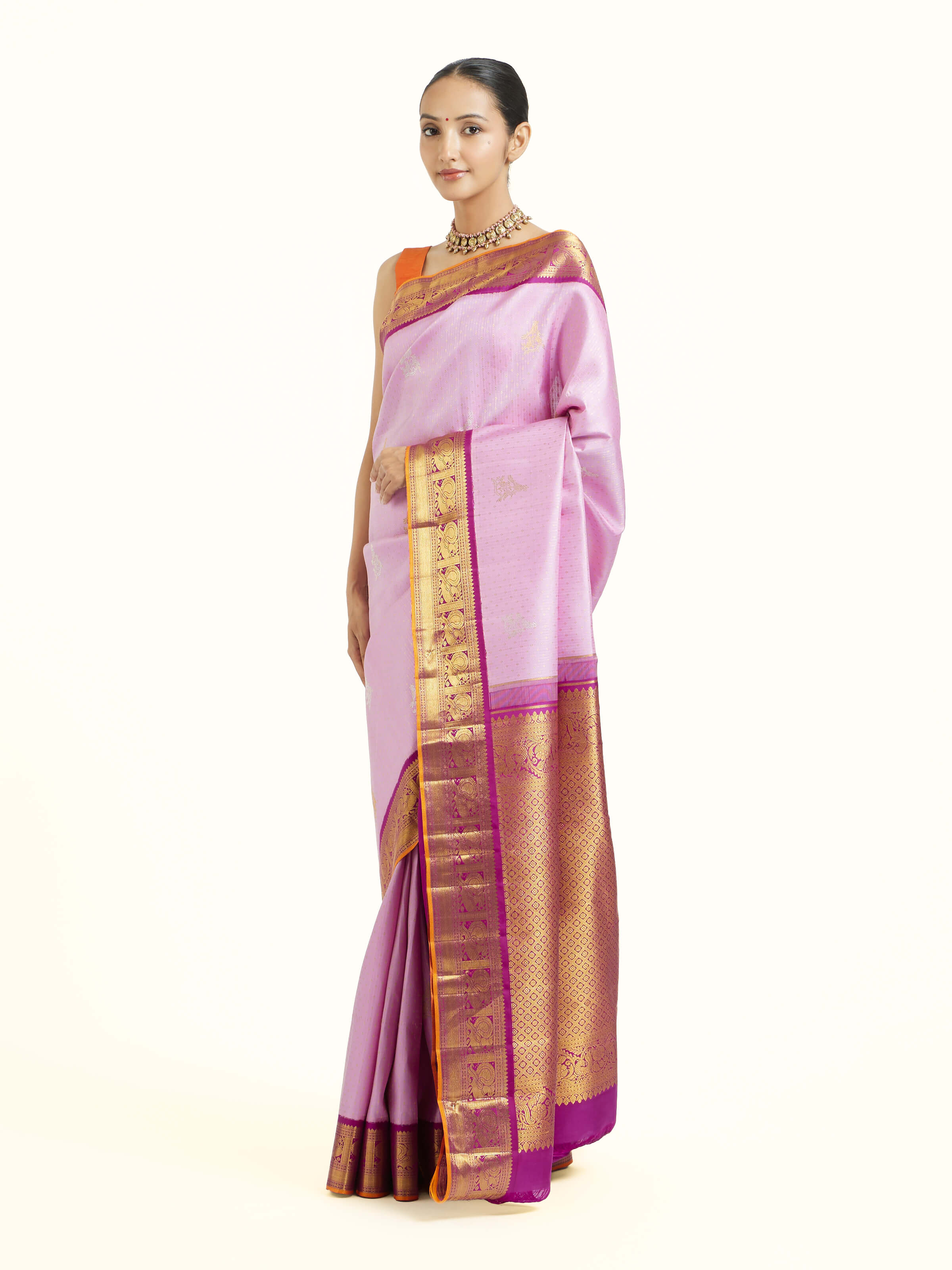 Side view of lavender silk Kancheepuram saree with graceful drape and contrast border