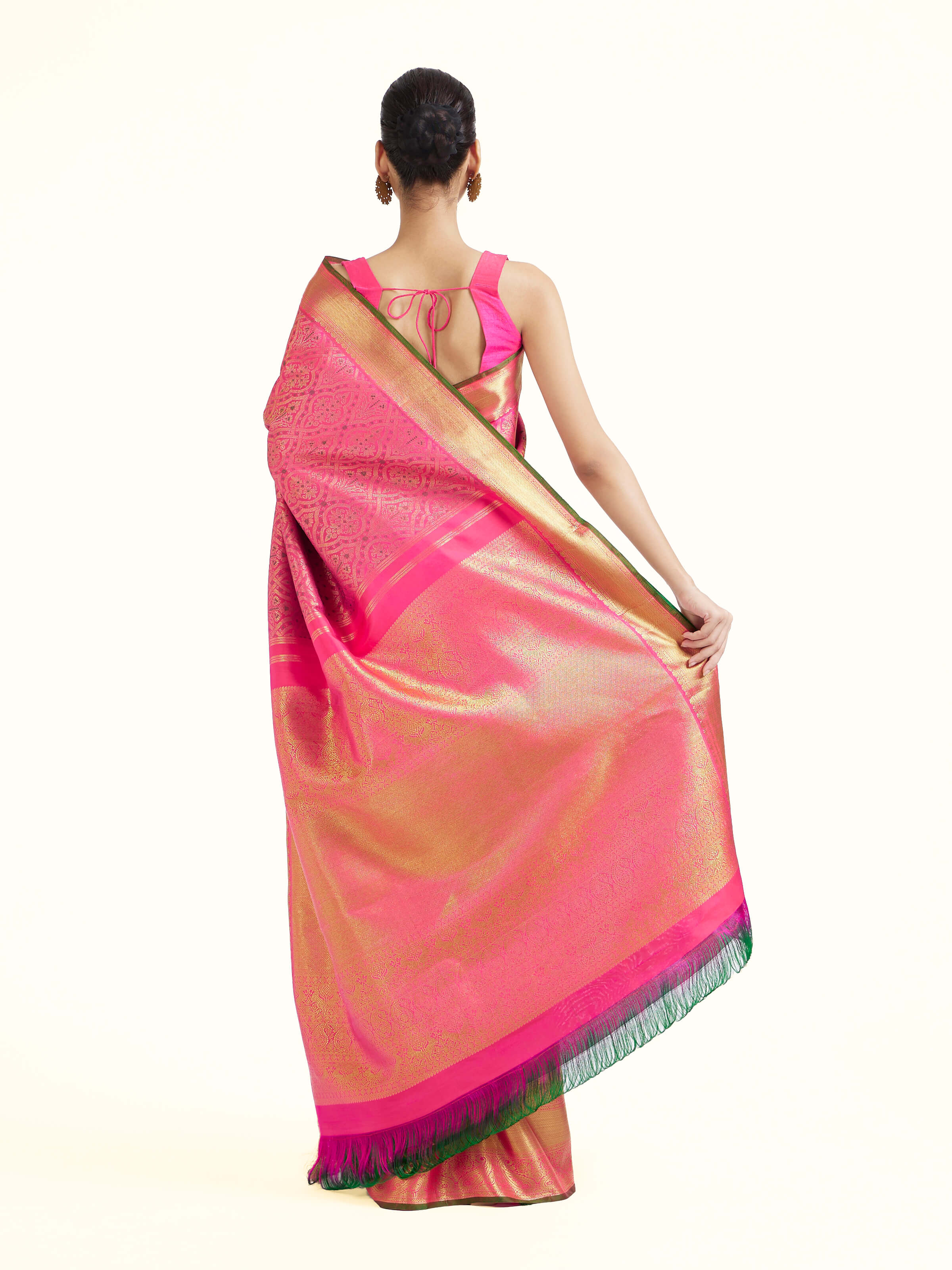 Back view of pink silk Kancheepuram saree displaying ornate pallu design