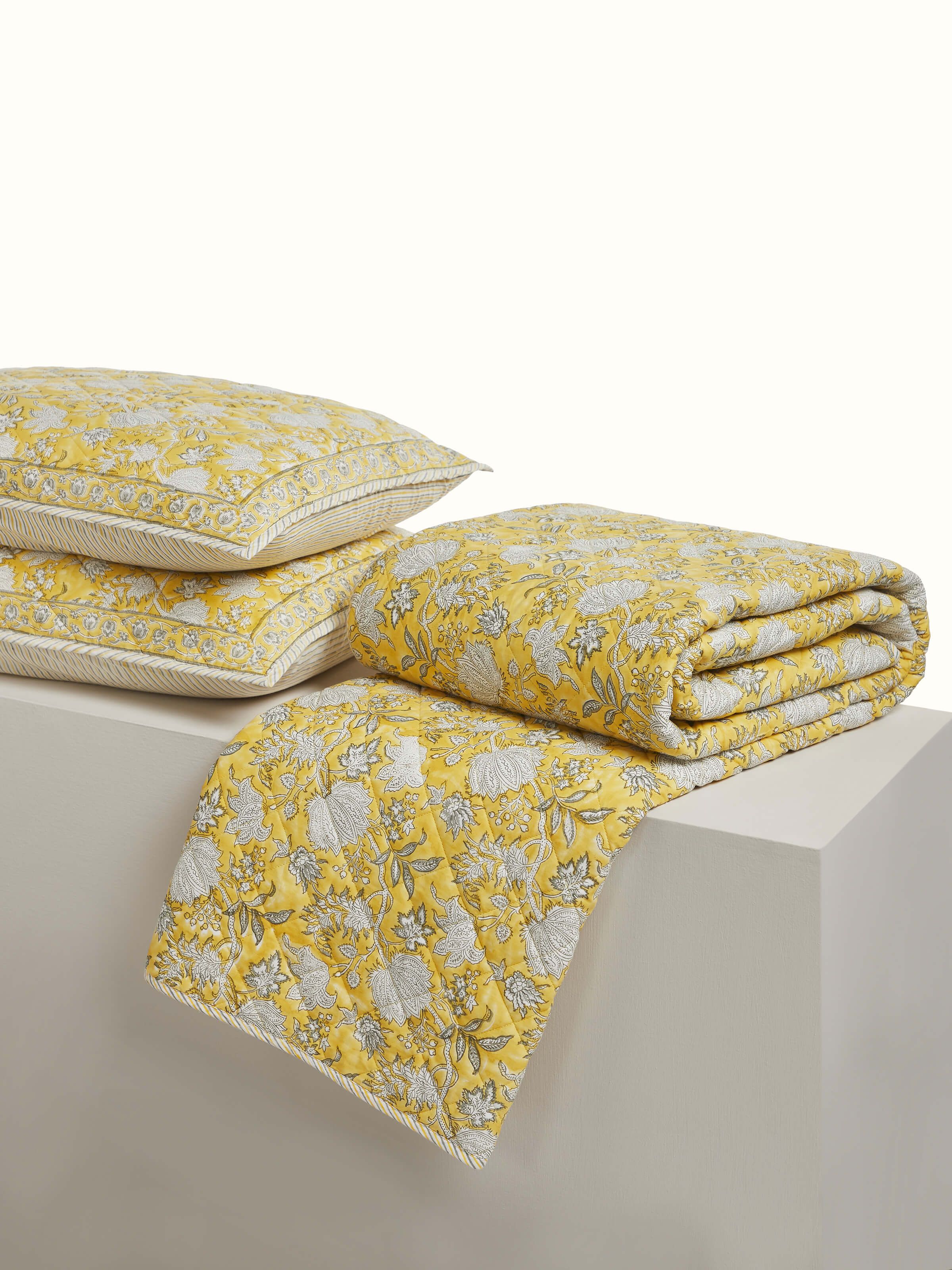 Alternate angle of Kairavam Yellow Floral Sanganeri Cotton Bedspread Set, highlighting quilted texture and soft fabric by Swadesh