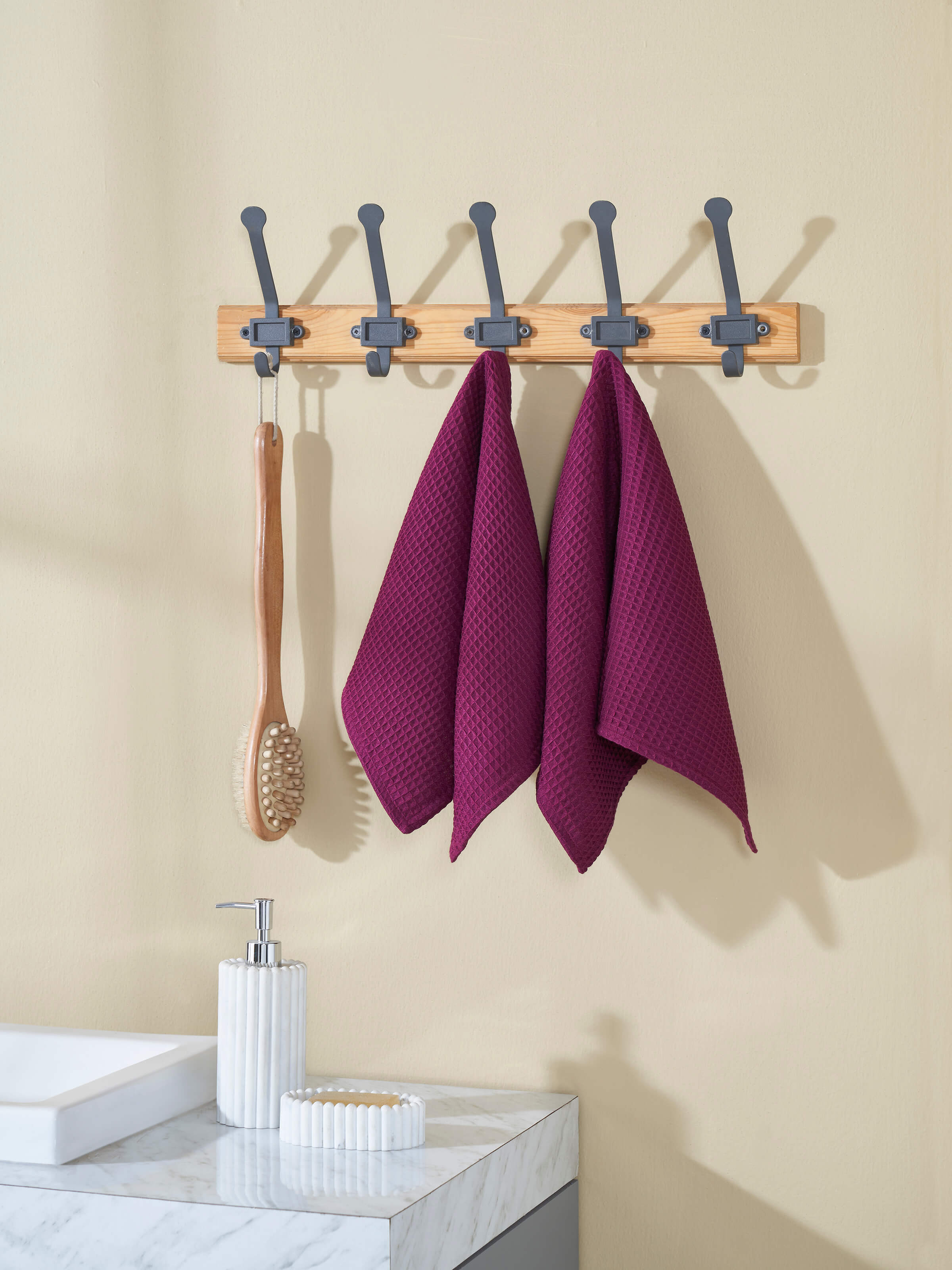 Amala purple waffle cotton hand towels placed in bathroom setting – set of 2