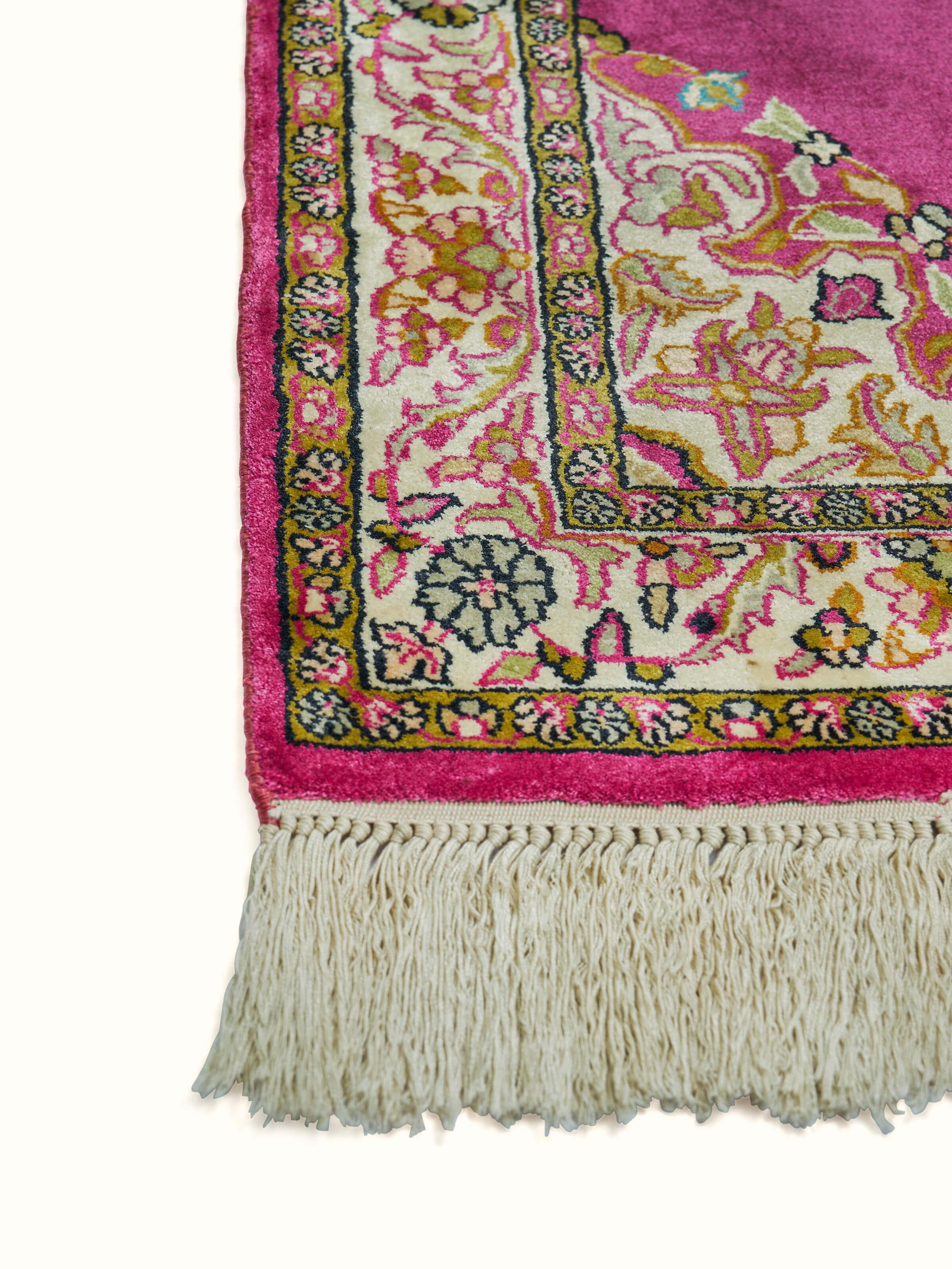 Angled view highlighting the elegant layout and color balance of the pink Kashmir carpet