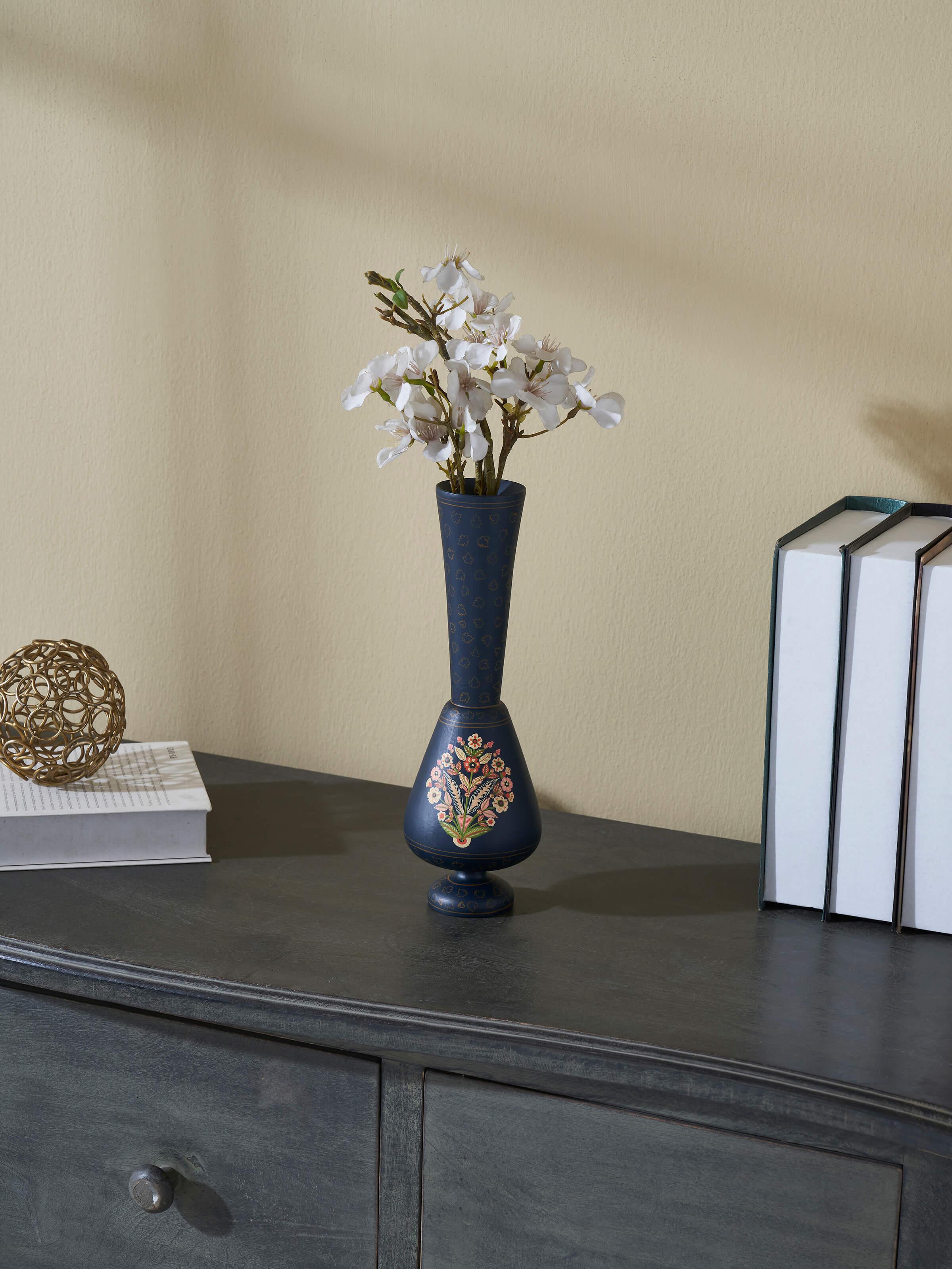 Side view of Papier-mache table vase in multicolor emphasizing its artistic design