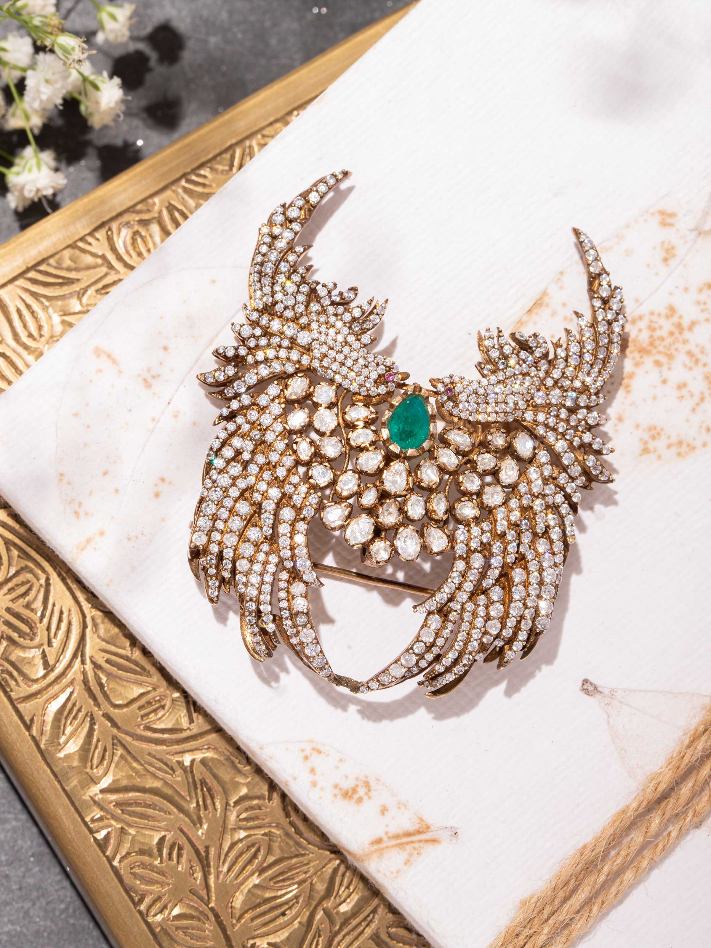 lifestyle view of silver smithing yellow gold brooch pin