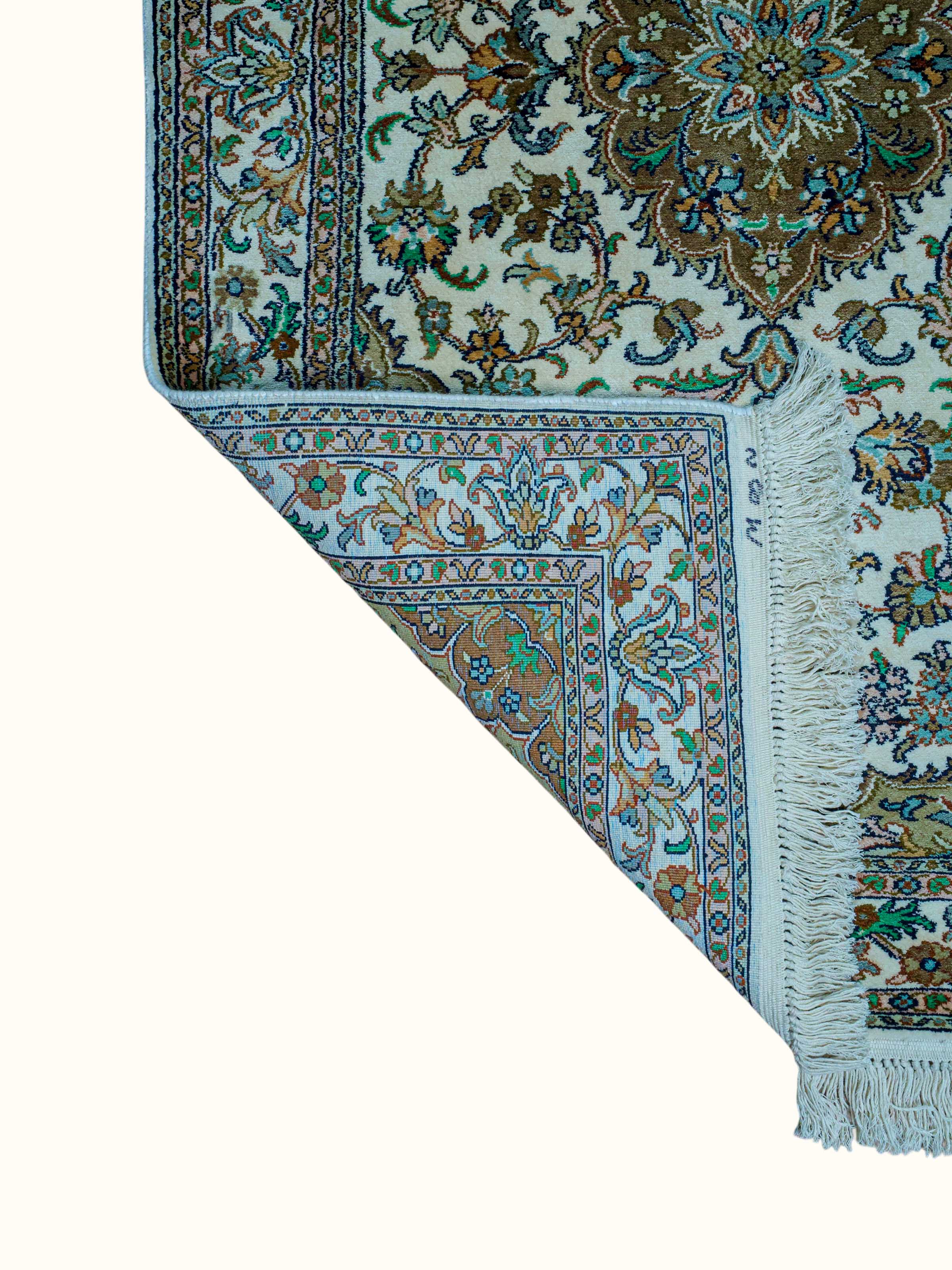 Side-angle view of the Traditional Persian Ivory Green Kashan Kashmir Silk Hand-Knotted Carpet