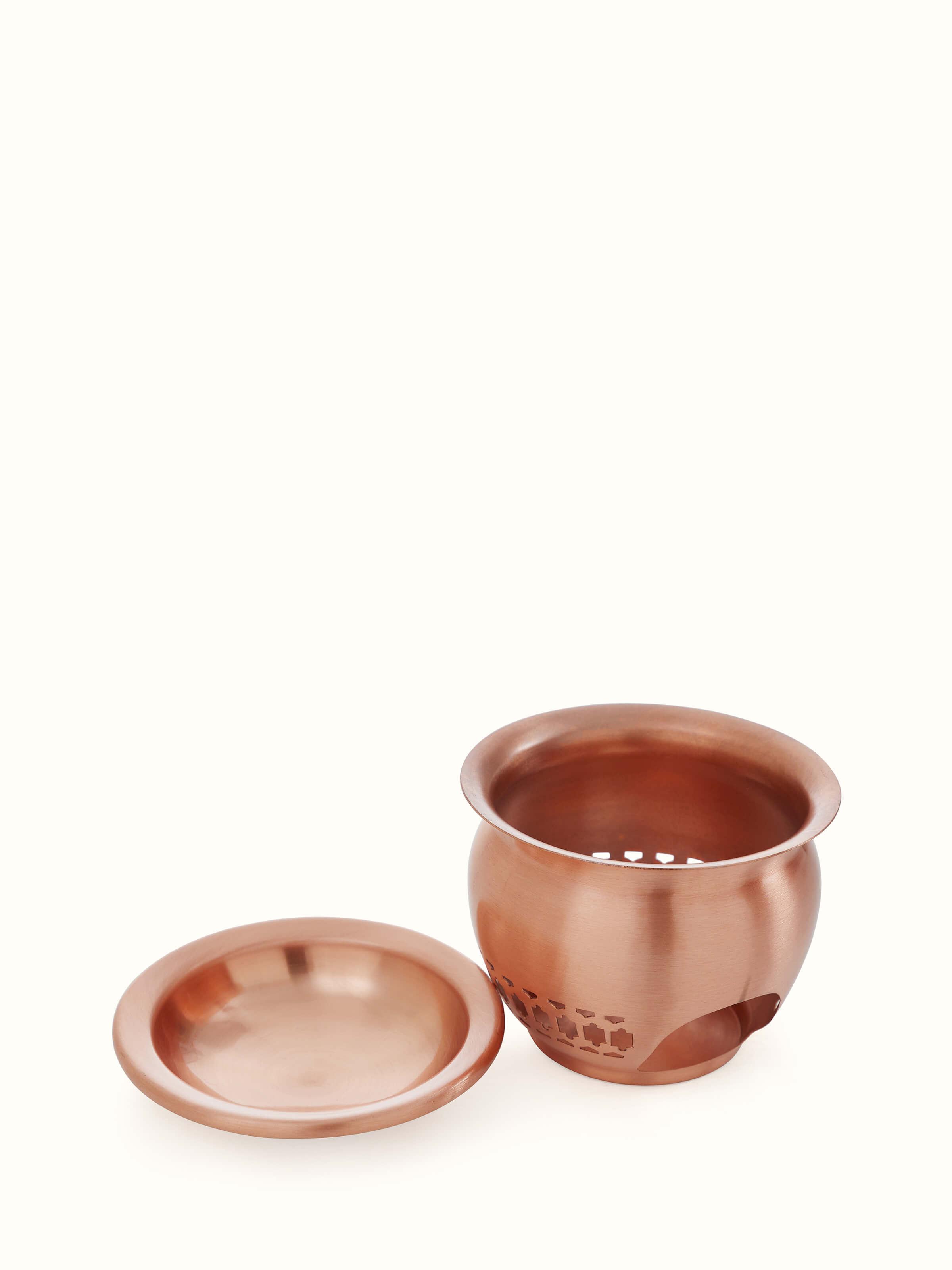 Angled view of natural copper diffuser focusing on fine craftsmanship and design elements