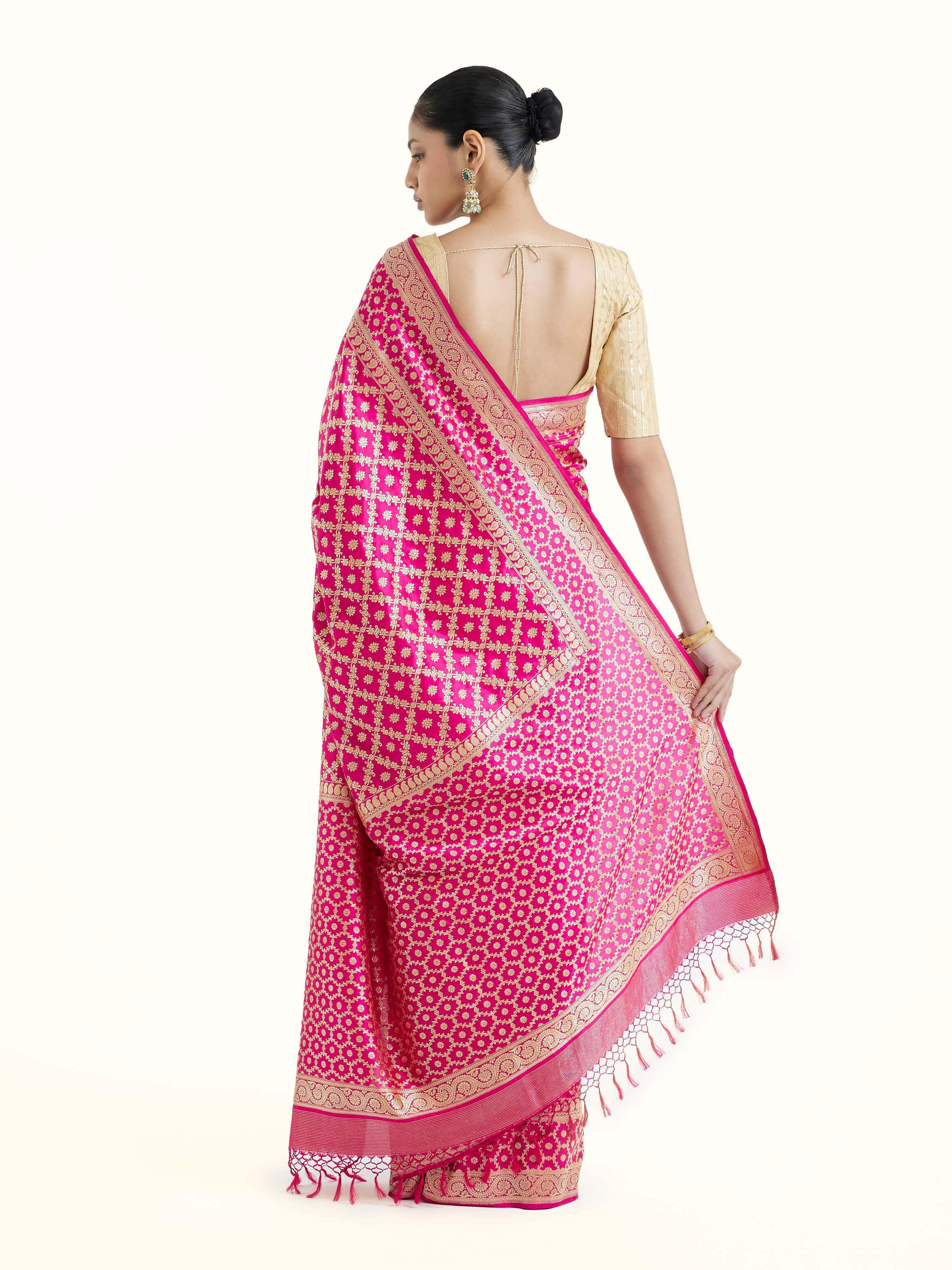 Back view of fuschia katan silk Banarasi saree displaying ornate pallu