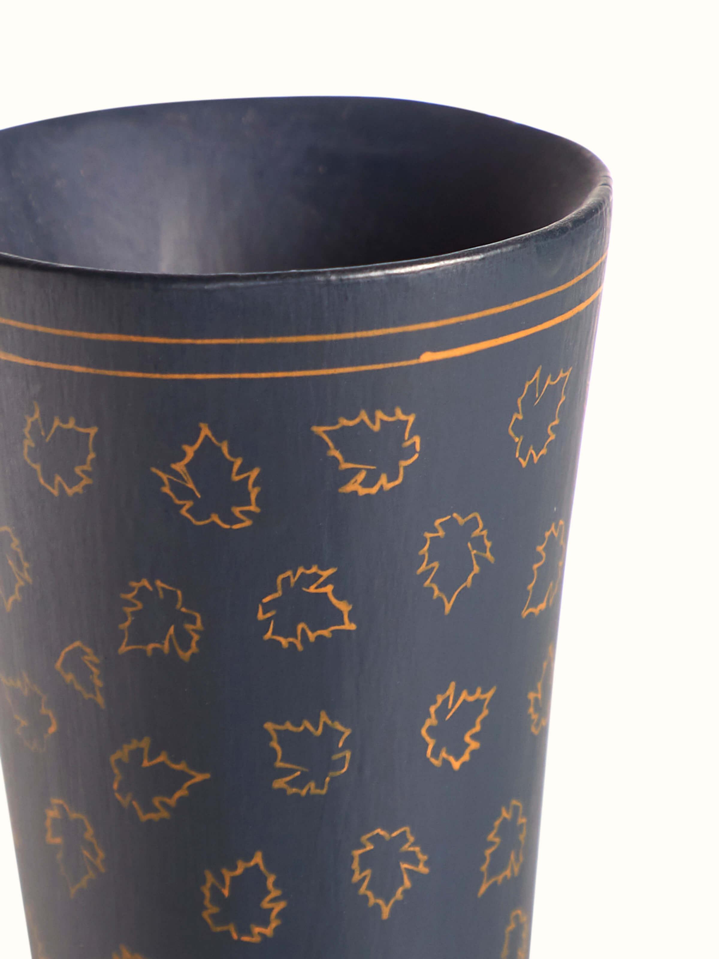 Angled view of Papier-mache table vase in multicolor showcasing design details