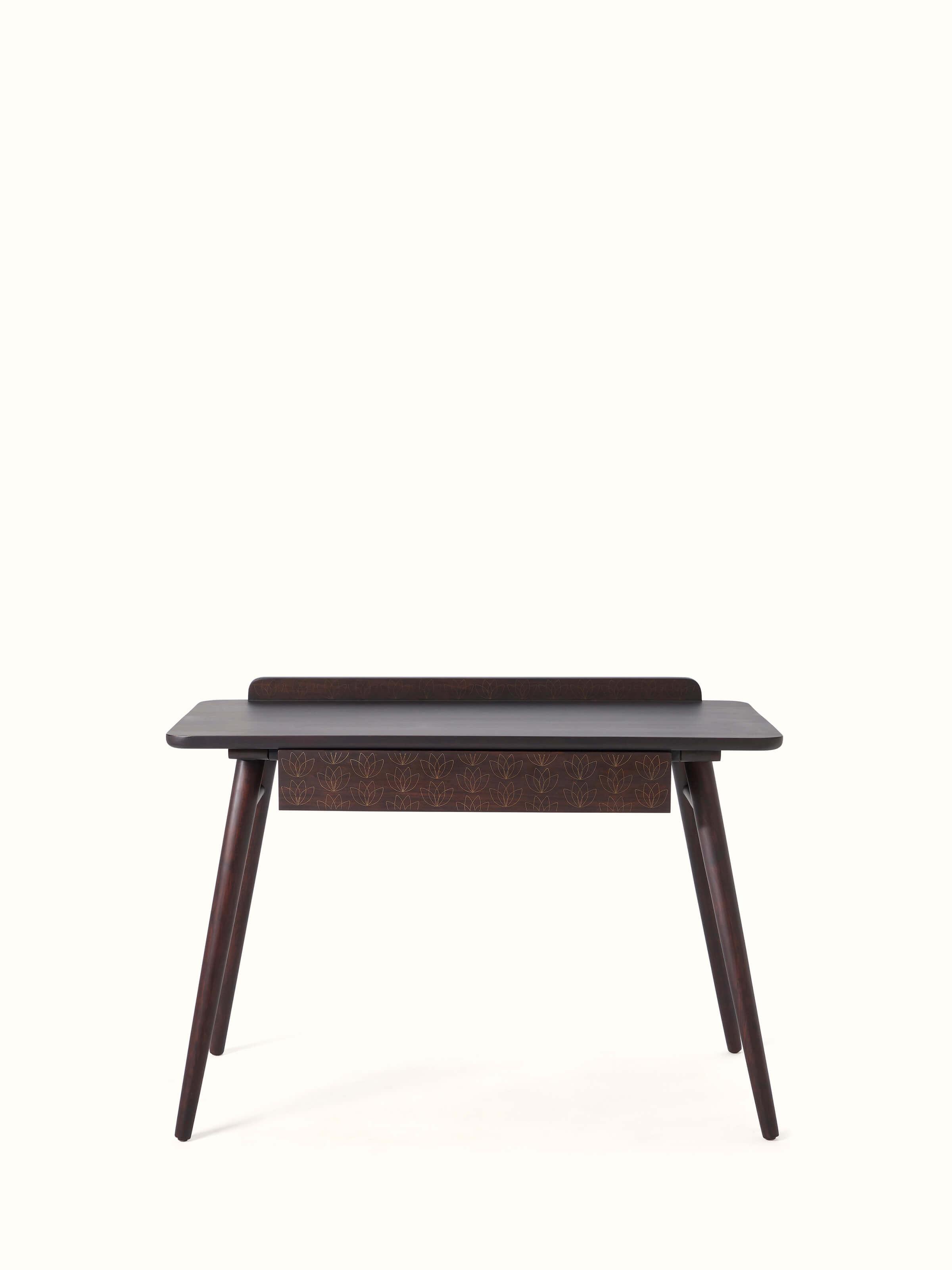 Front view of Sheesham wood study table with intricate brass tarkashi inlay, showcasing the elegant design and detailed craftsmanship