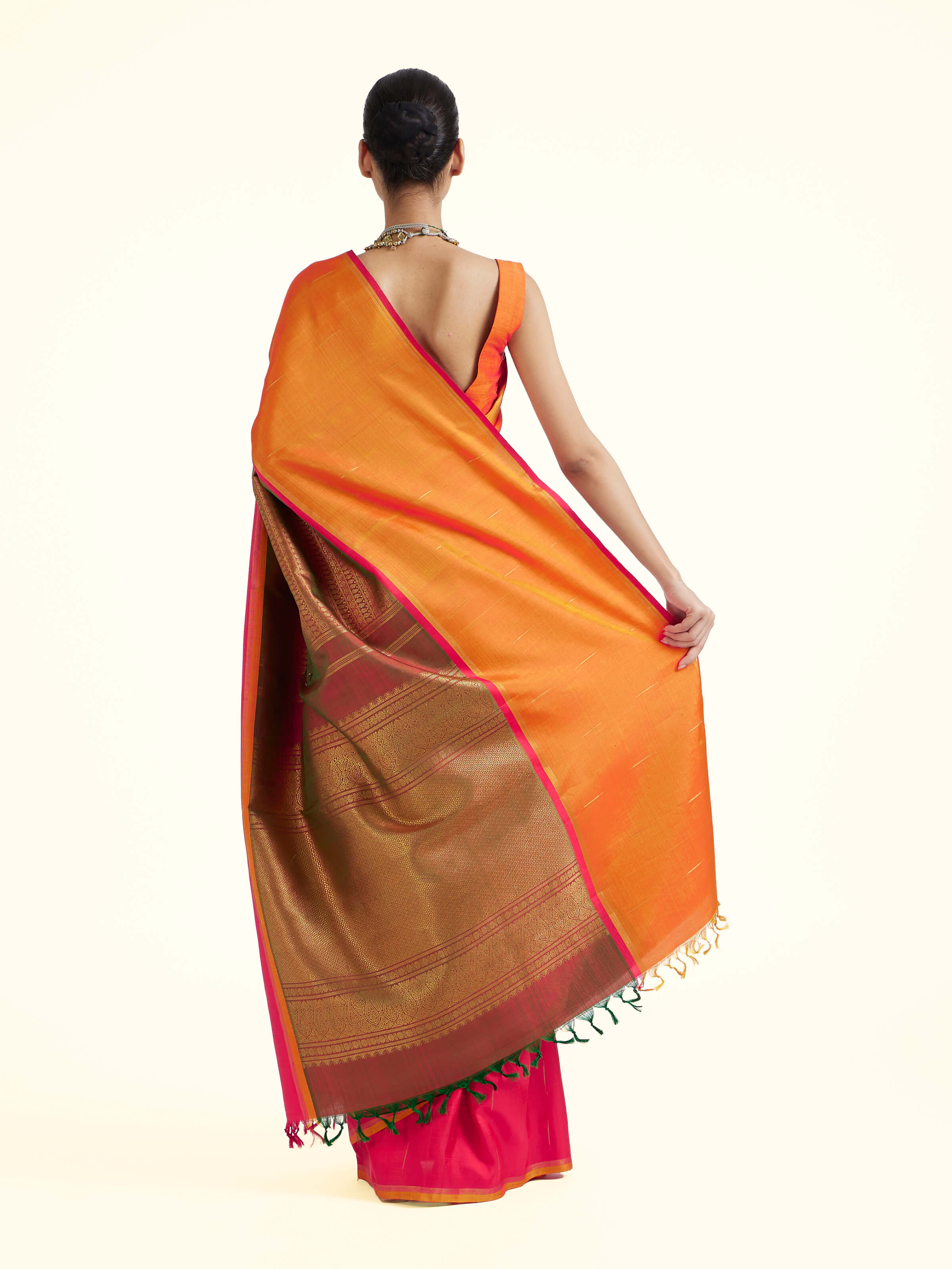 Back view of red silk Kancheepuram saree displaying grand pallu