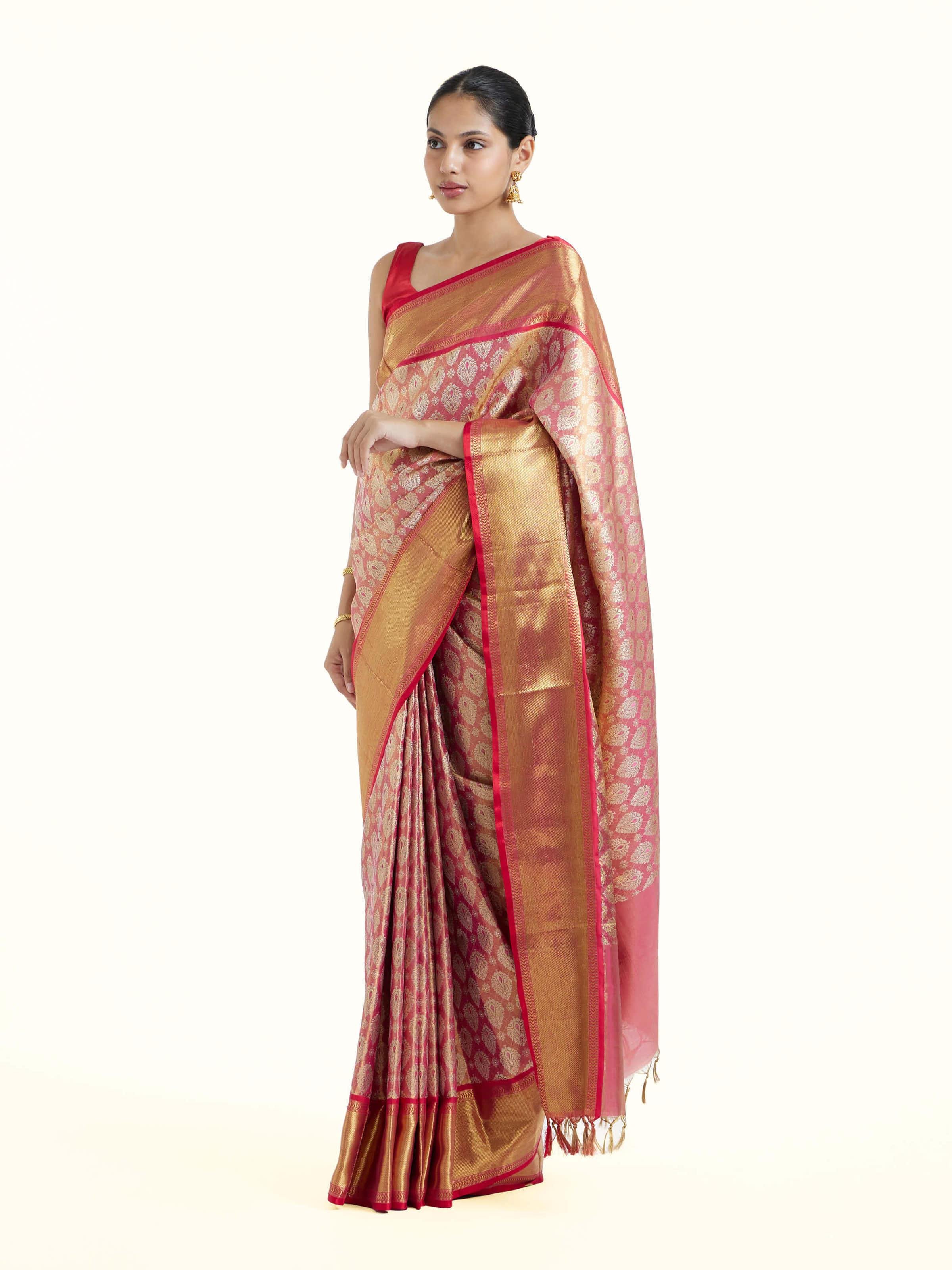Side view of pink silk Kancheepuram saree with graceful drape and contrast border