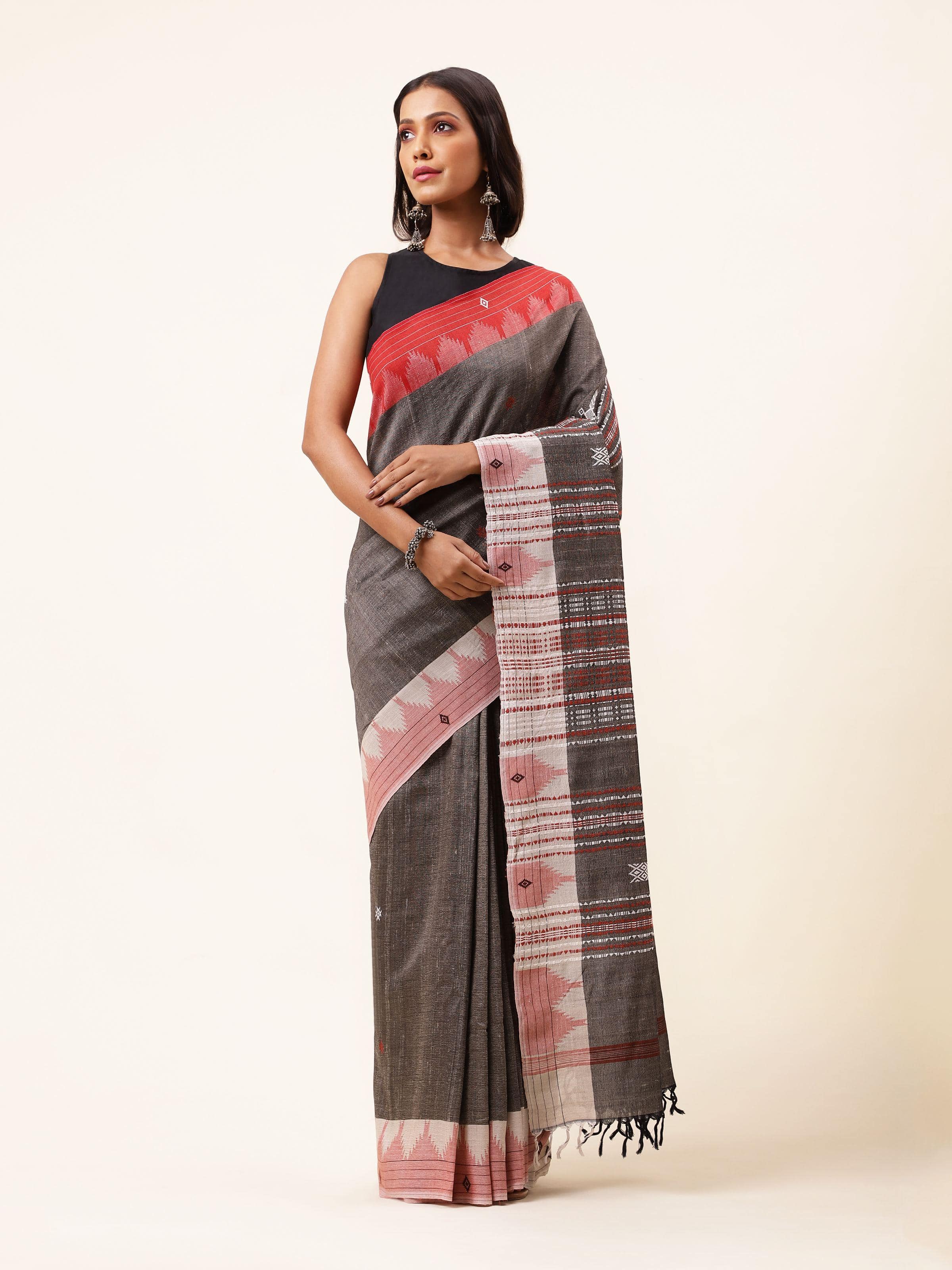 Front view of brown cotton Tussar silk Kotpad saree with tribal motifs and earthy tone