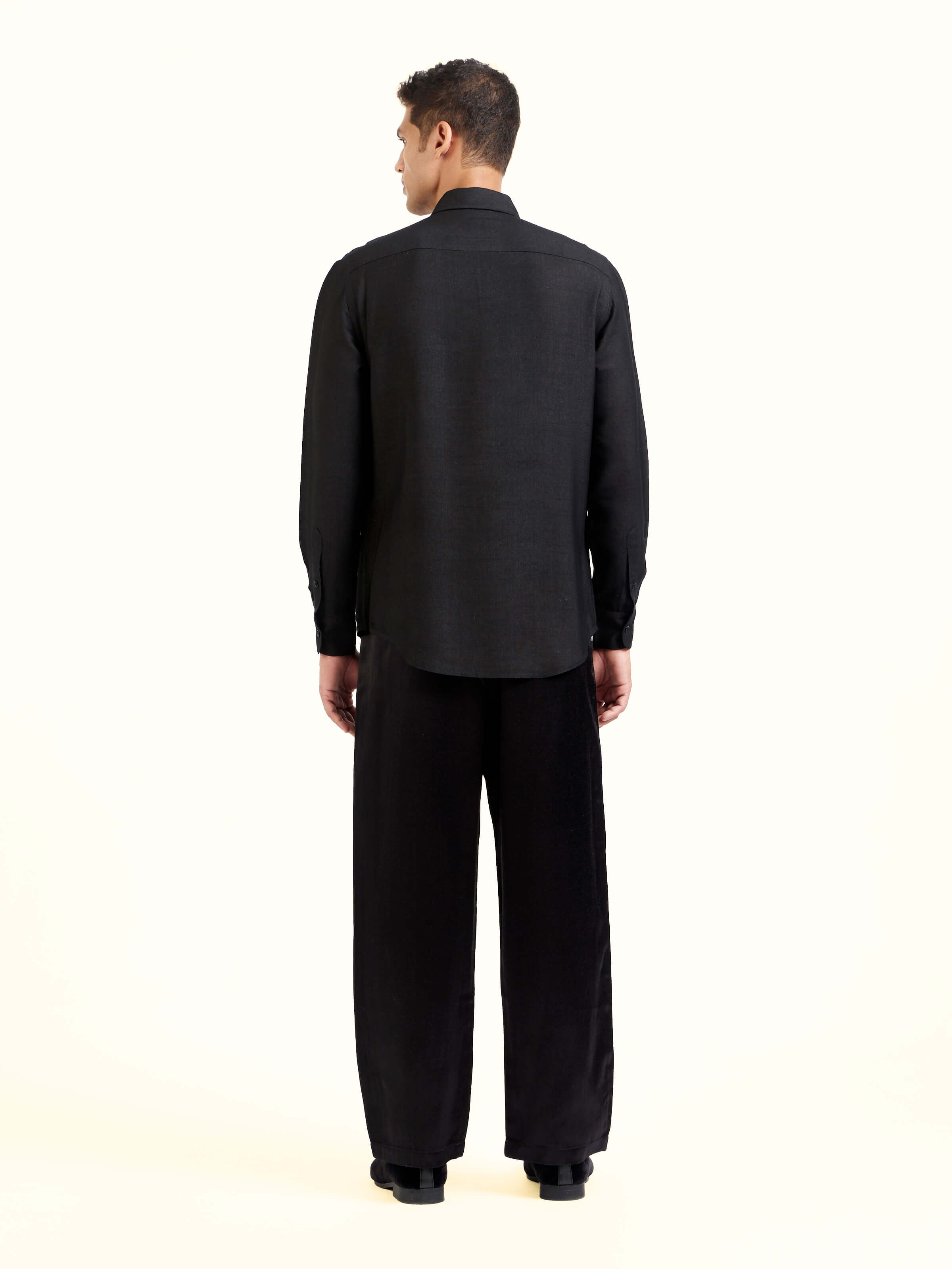 Back view of black hand embroidery shirt displaying structured finish