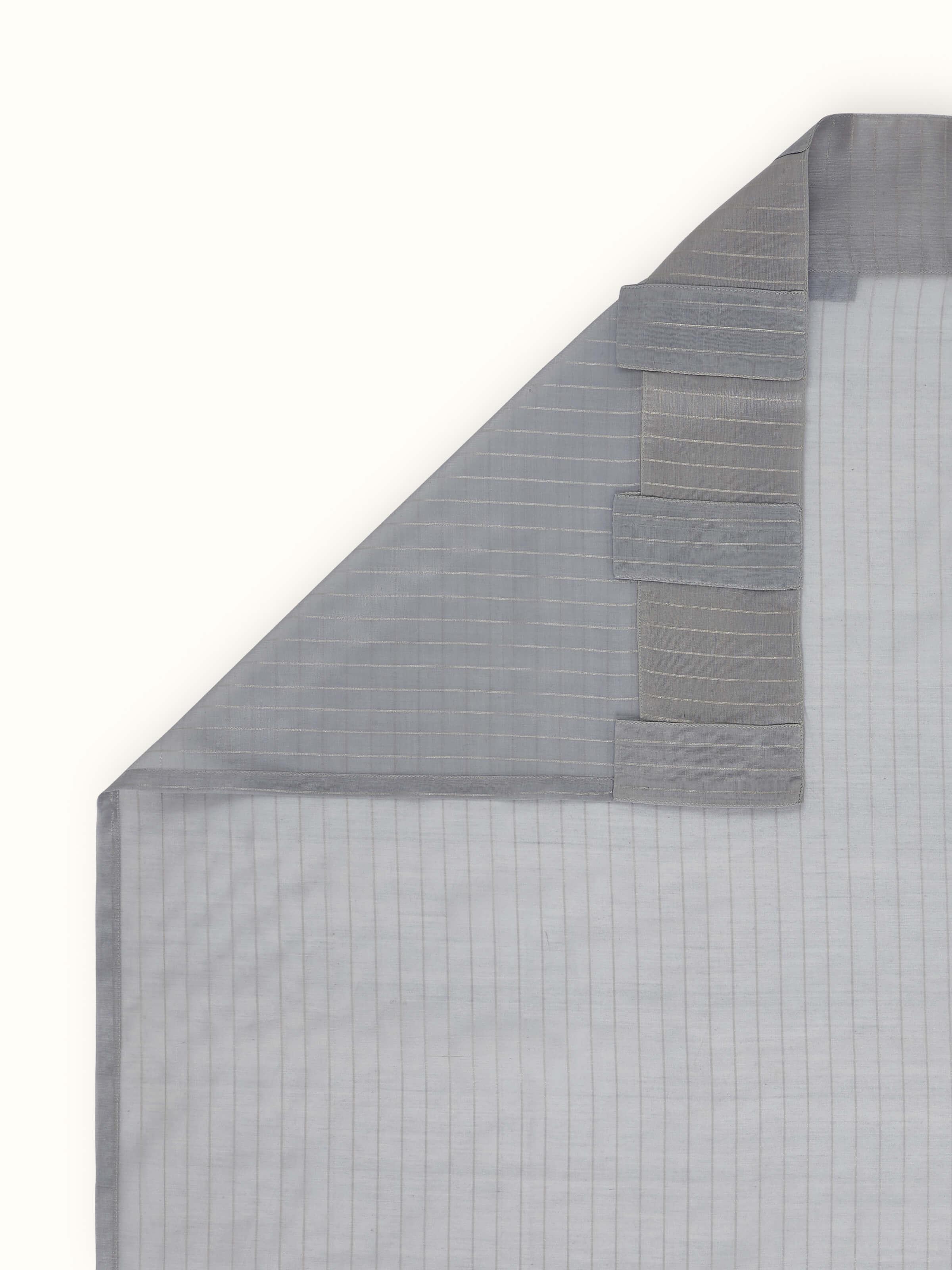 Back view showing sheer fabric and fine handloom detailing of grey metallic stripe curtain.