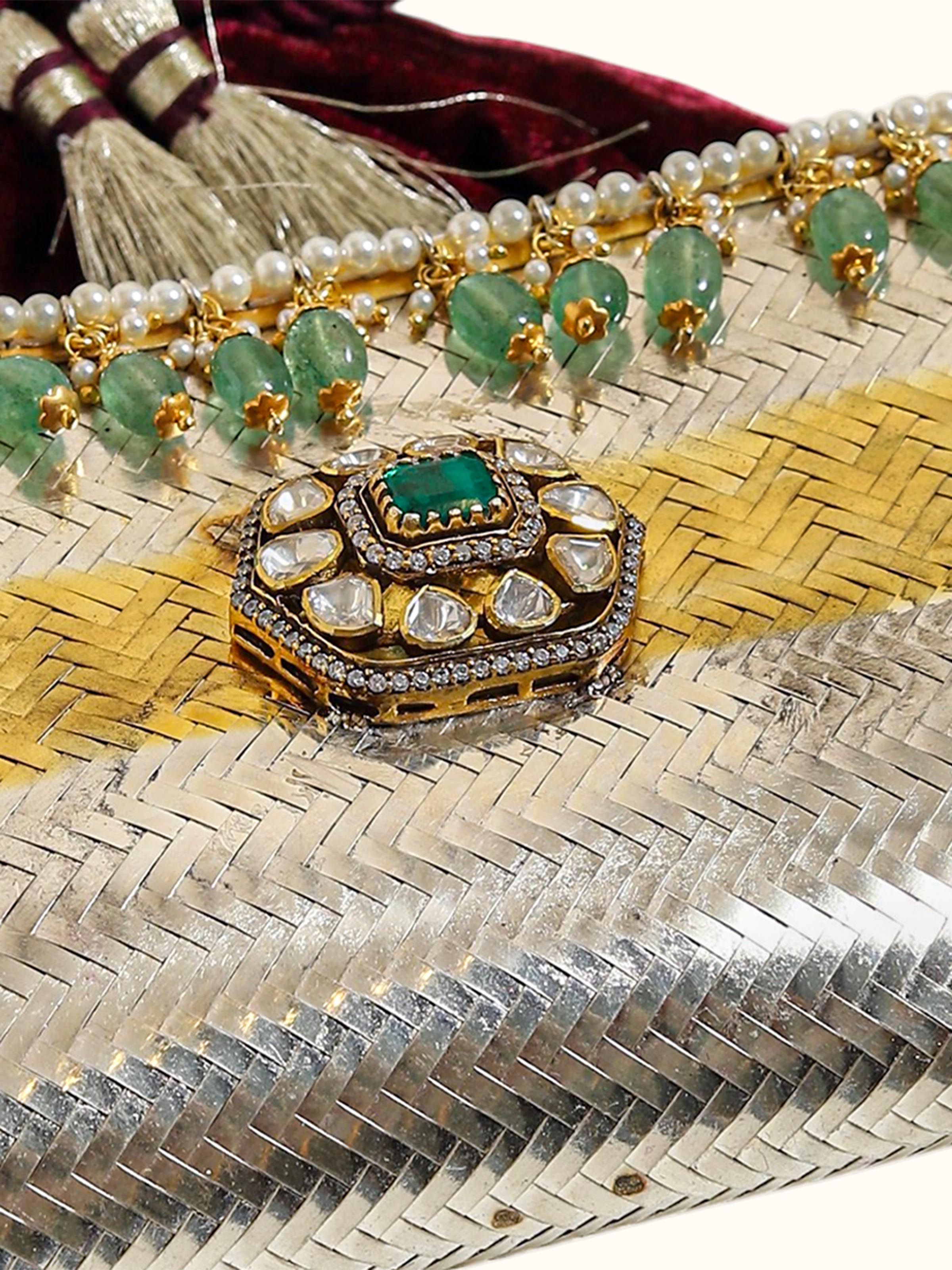 detail view of silver smithing two-tone potli-style bag texture