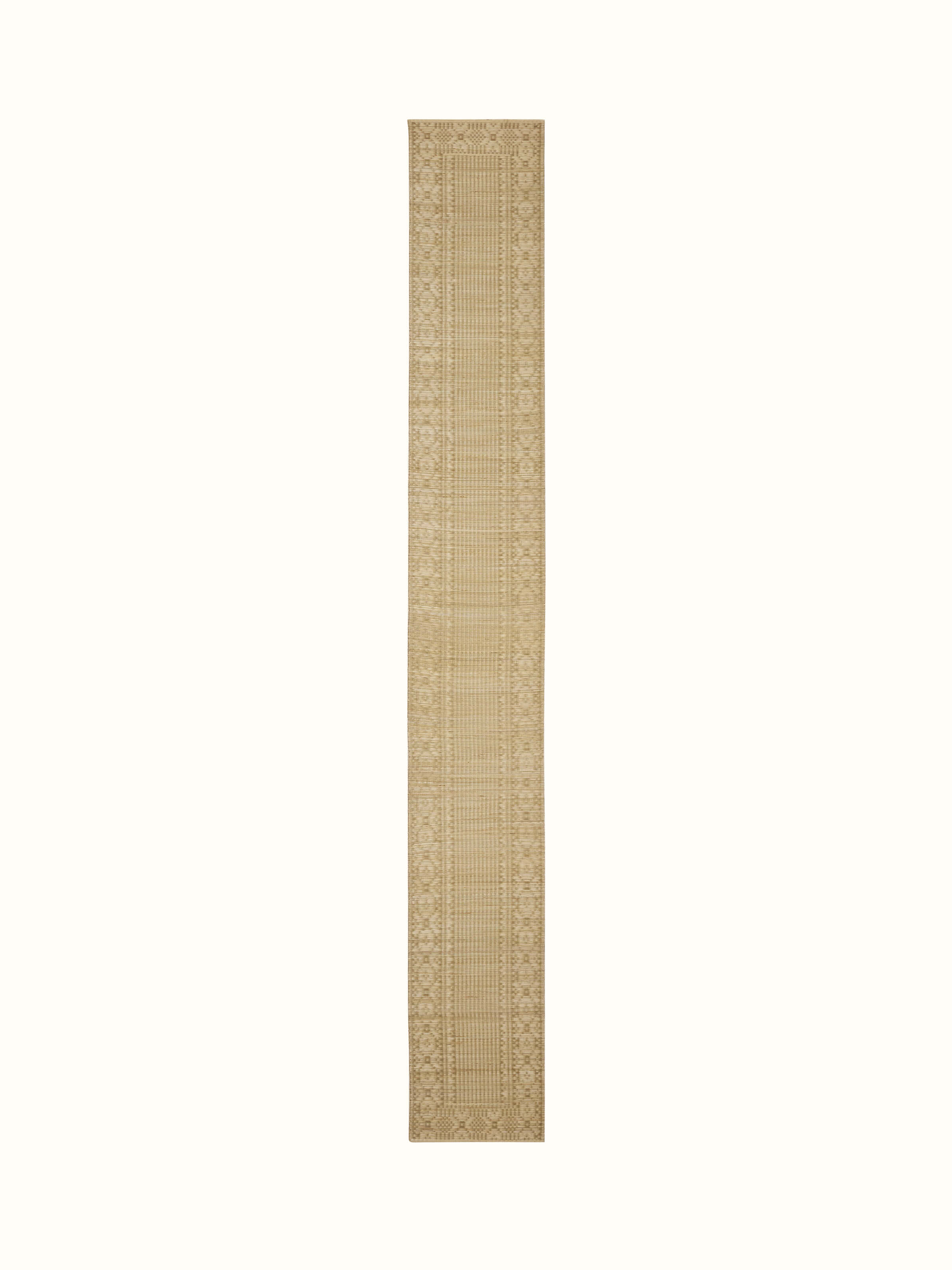 Front view showcasing the beige folk geometric design on the natural fibre Madurkathi table runner