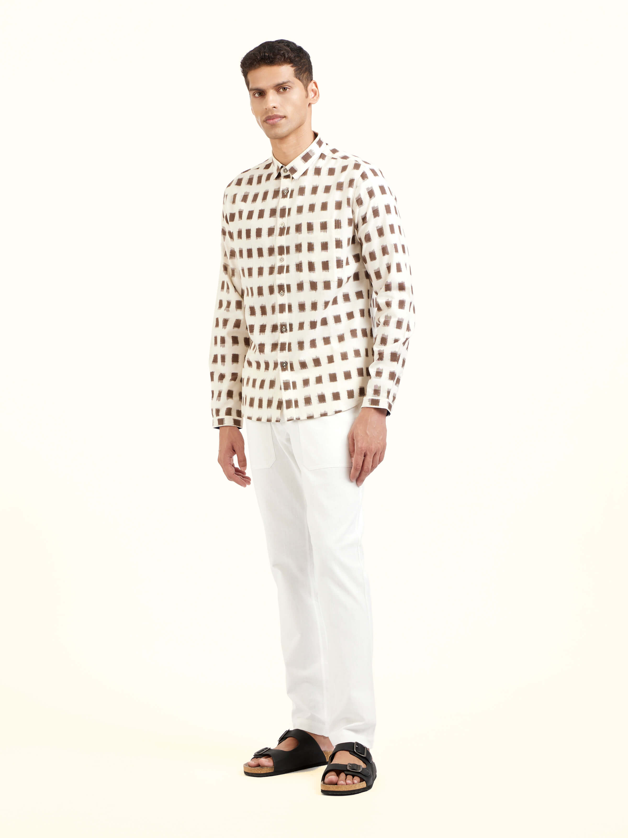 Side view of white cotton Telangana Ikat shirt highlighting tailored fit