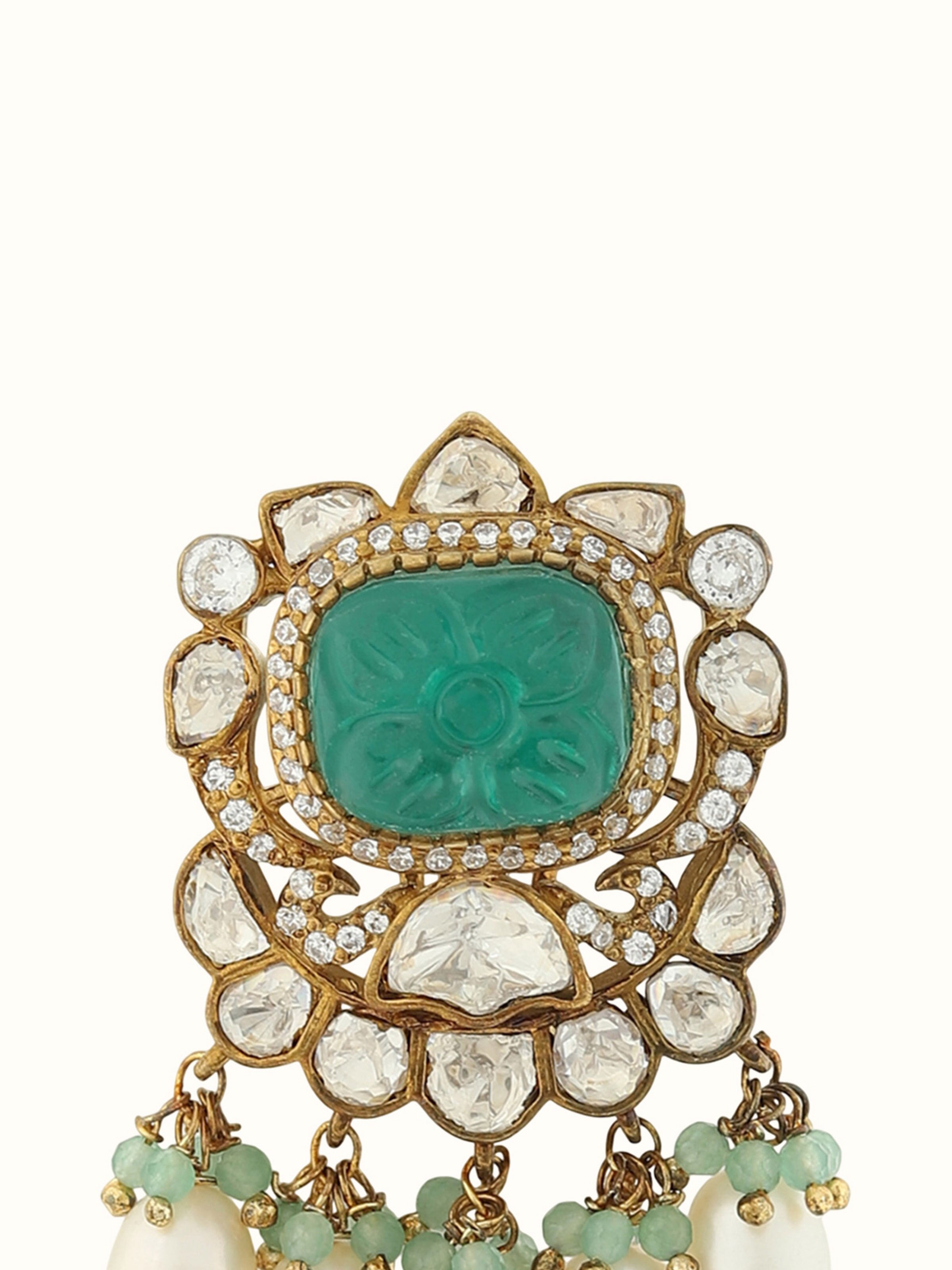 Detail shot capturing etched textures and fine detailing of drop earrings.