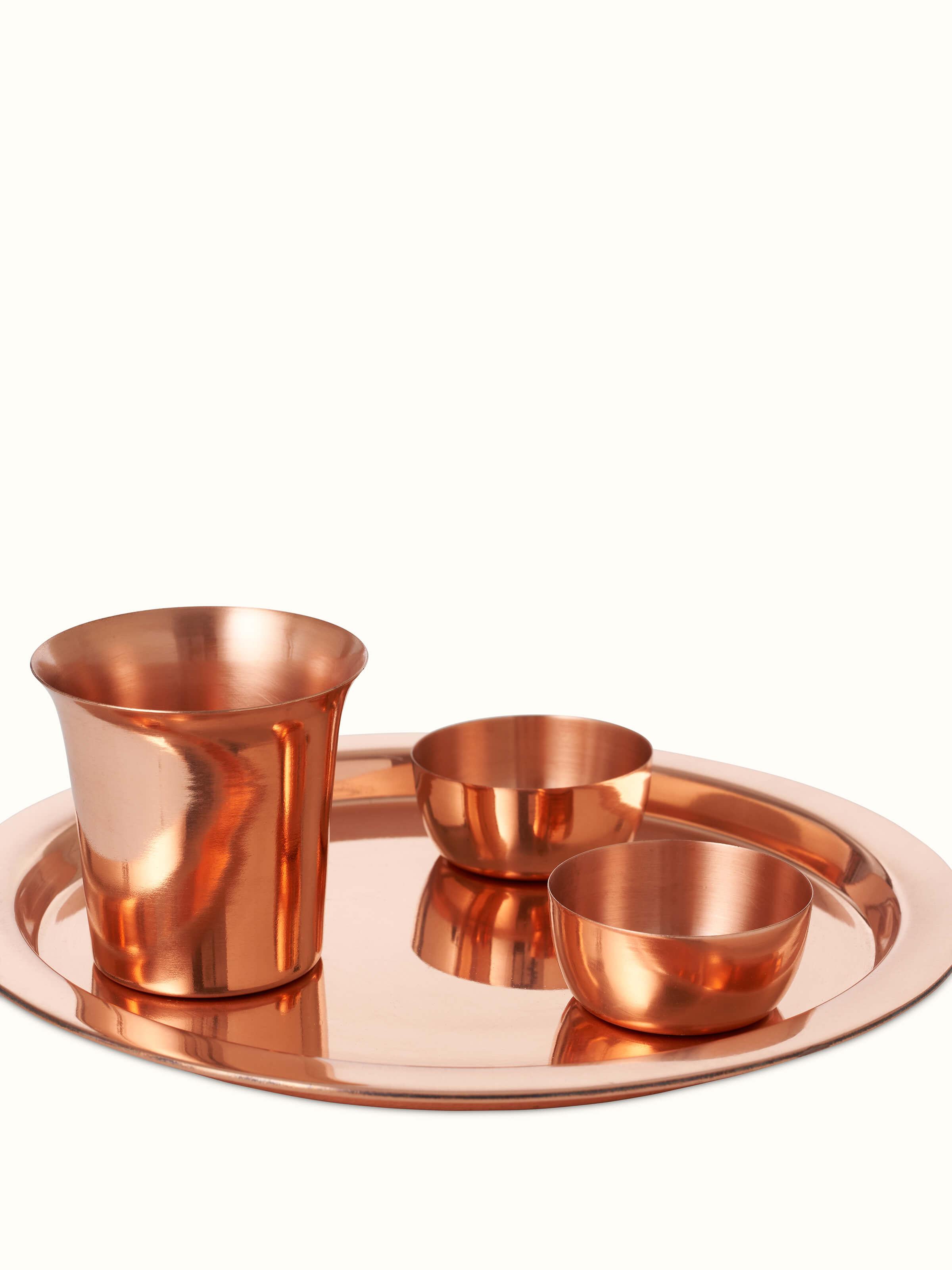 Detailed view of Polished Copperware Pooja Thali Set (4 pcs) showcasing intricate design elements