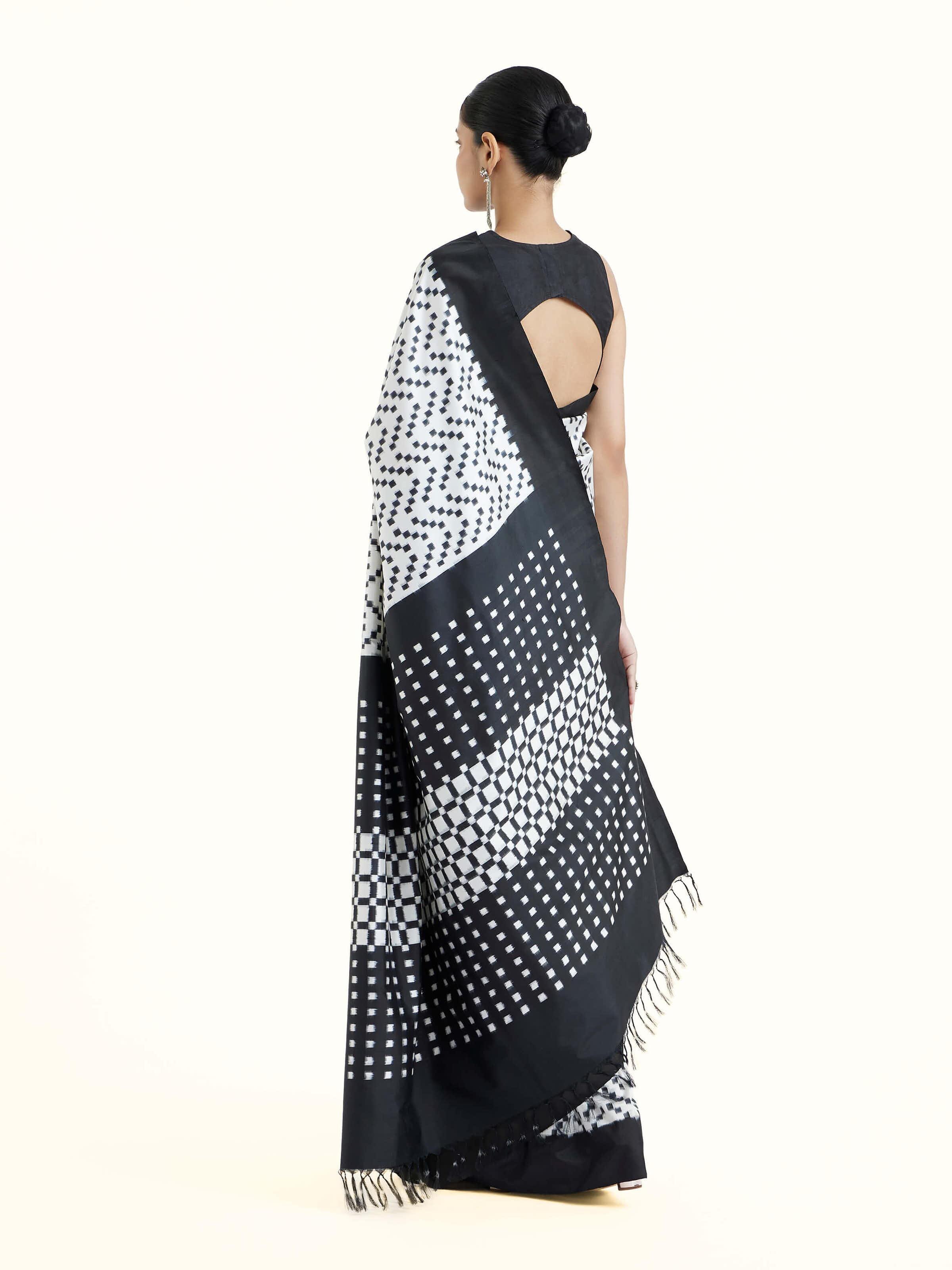 Back view of black silk double ikat saree displaying full pallu design