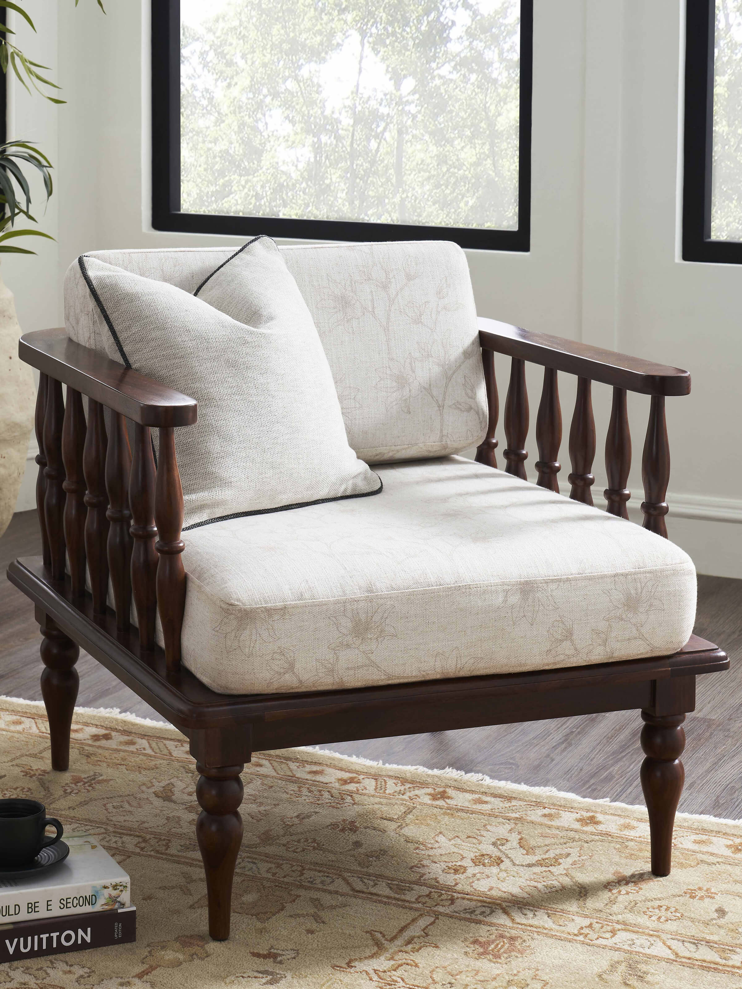 Side view of Swadesh Teak Finish Upholstered Sheesham Wood 1-seater Sofa showcasing rich wood texture and elegant upholstery