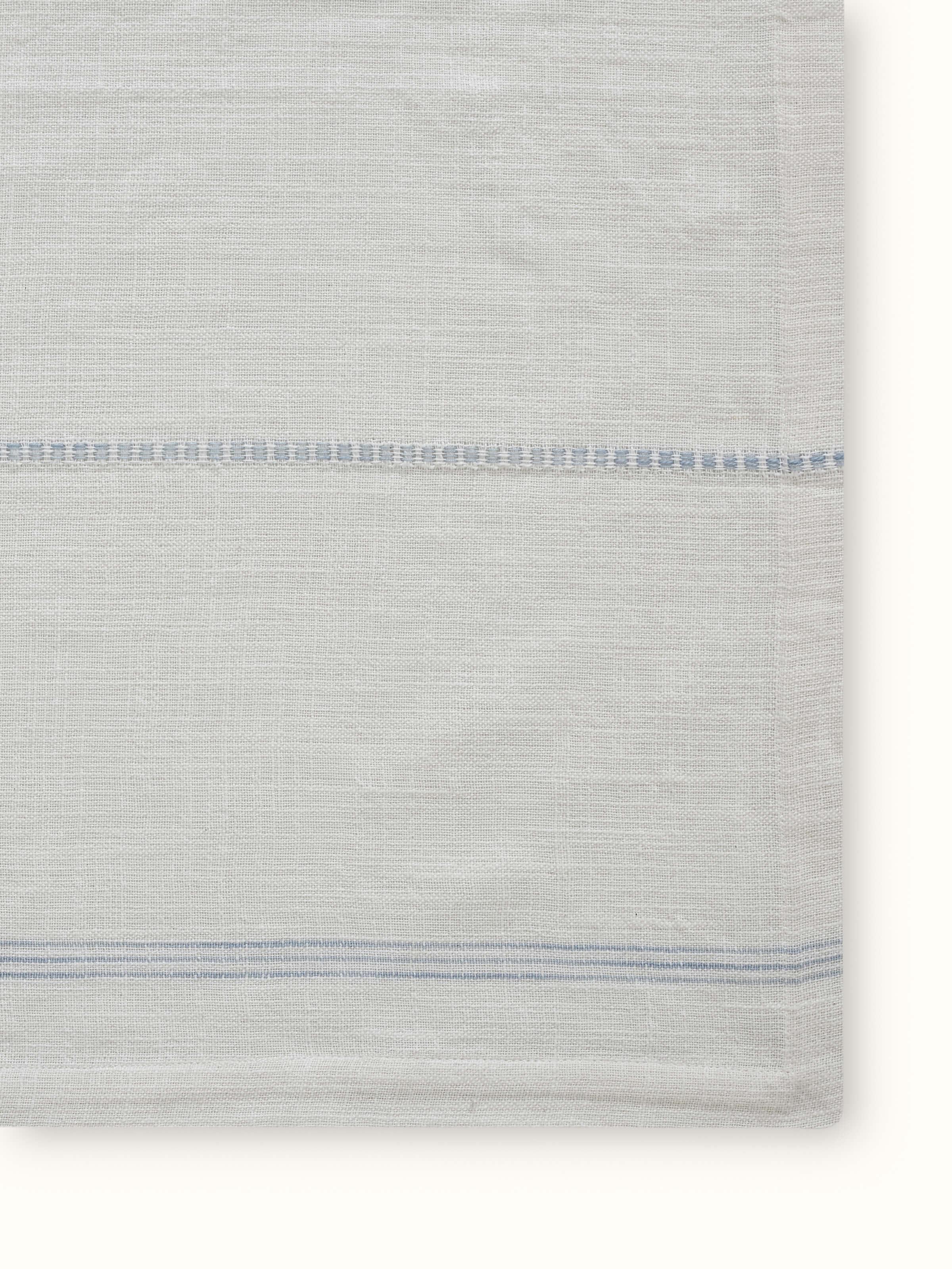 Angled view of Arth Light Blue Stripe Cotton Handloom Table Cover showing textured weave and soft hues