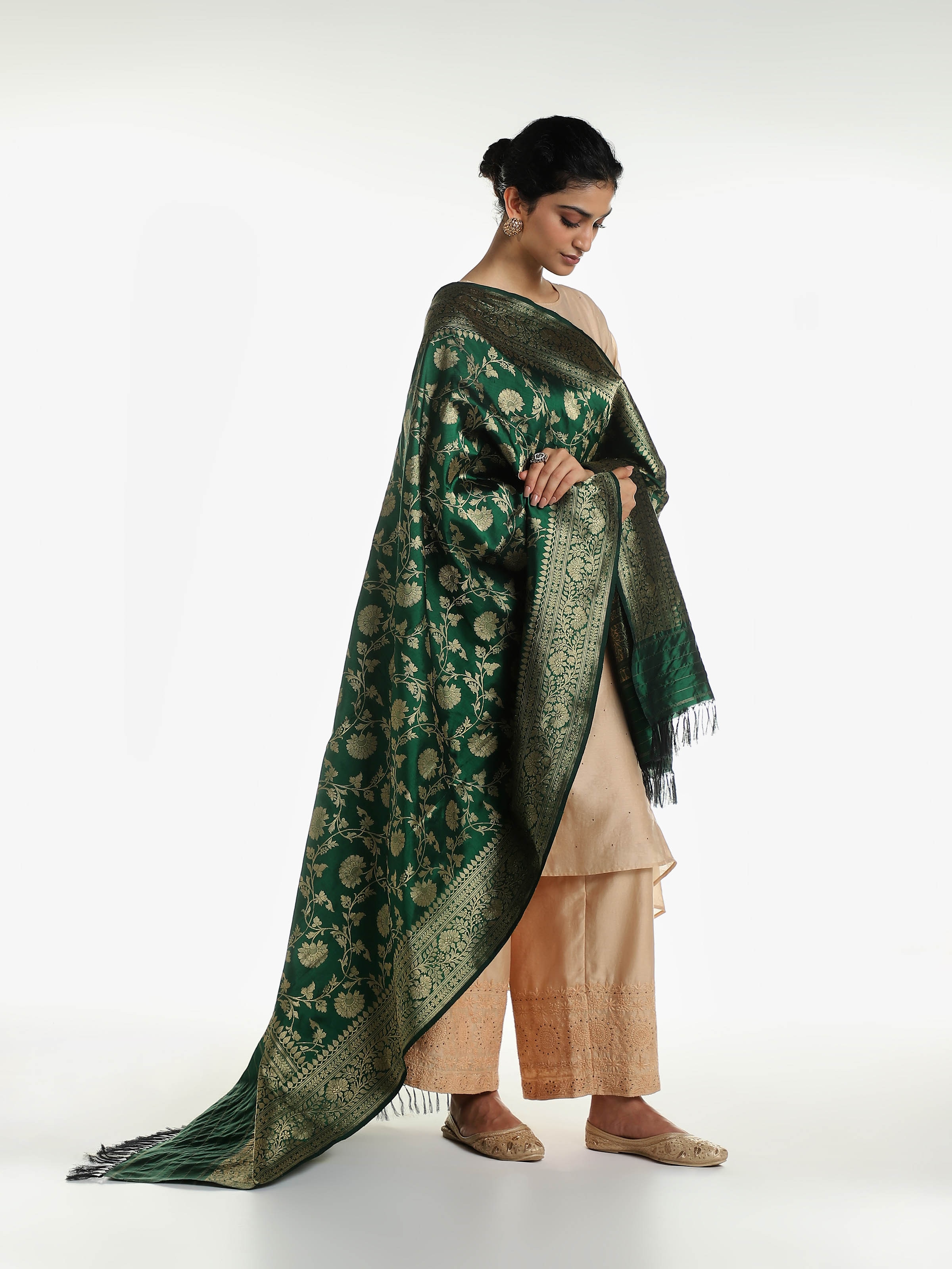 Side view of dark green silk Banarasi dupatta with elegant drape