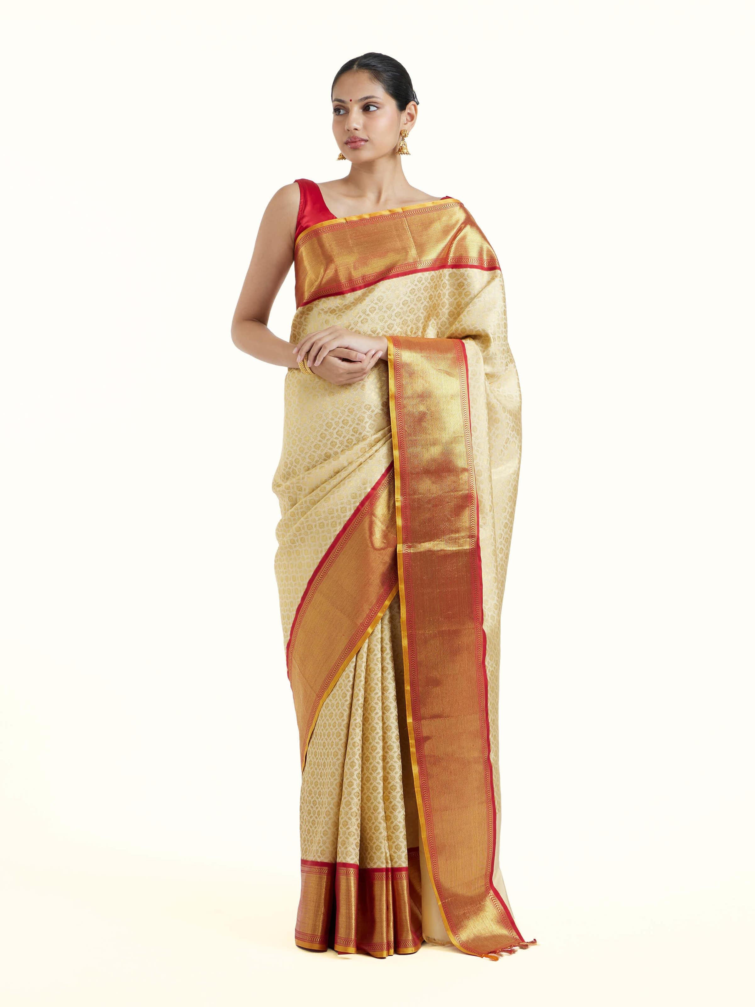 Front view of peach silk Kancheepuram saree showing soft hue and rich silk texture