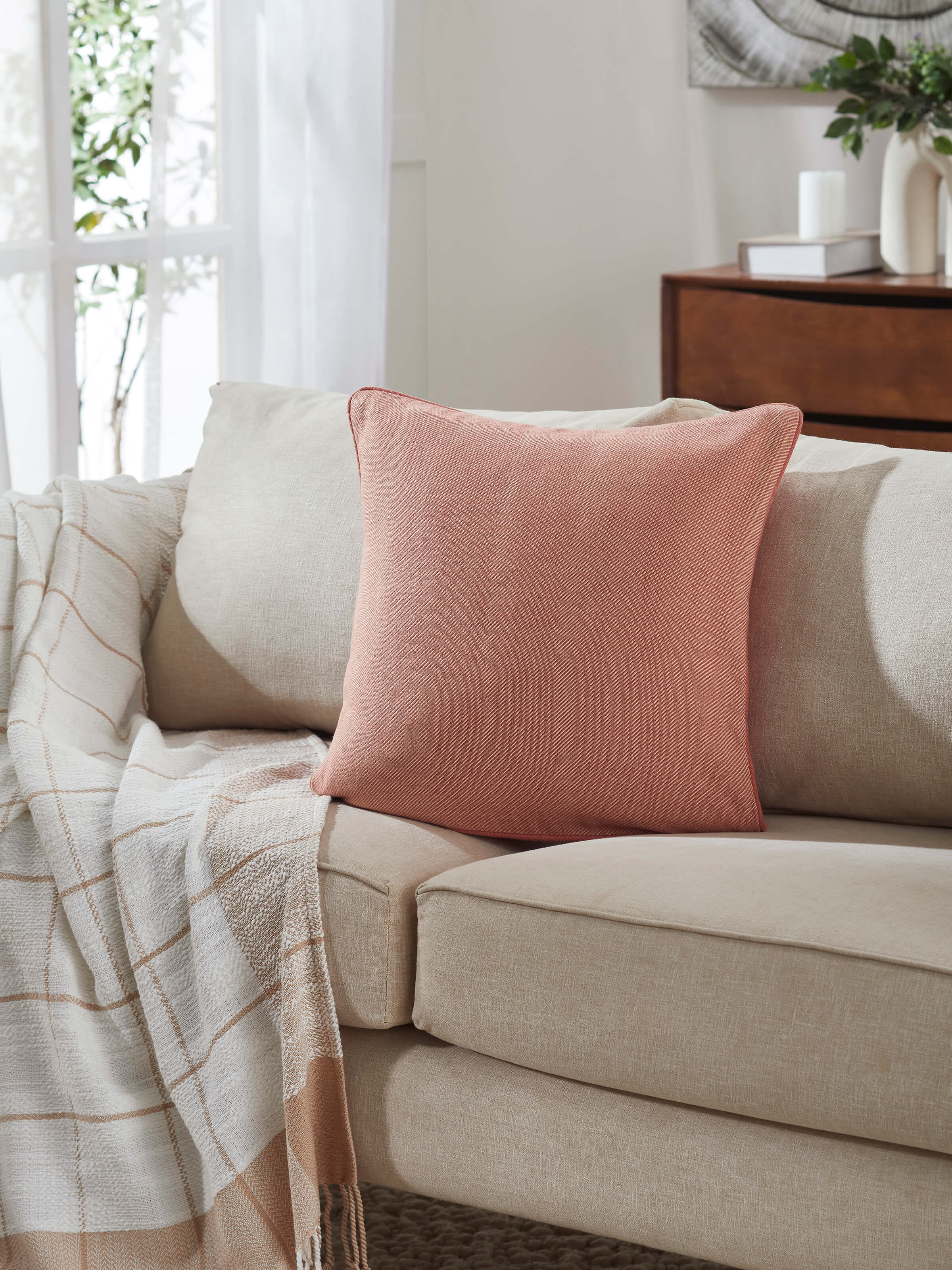 Side view of Godna Peach Diamond Cotton Handwoven Pattu Cushion Cover highlighting the detailed weave and textured finish