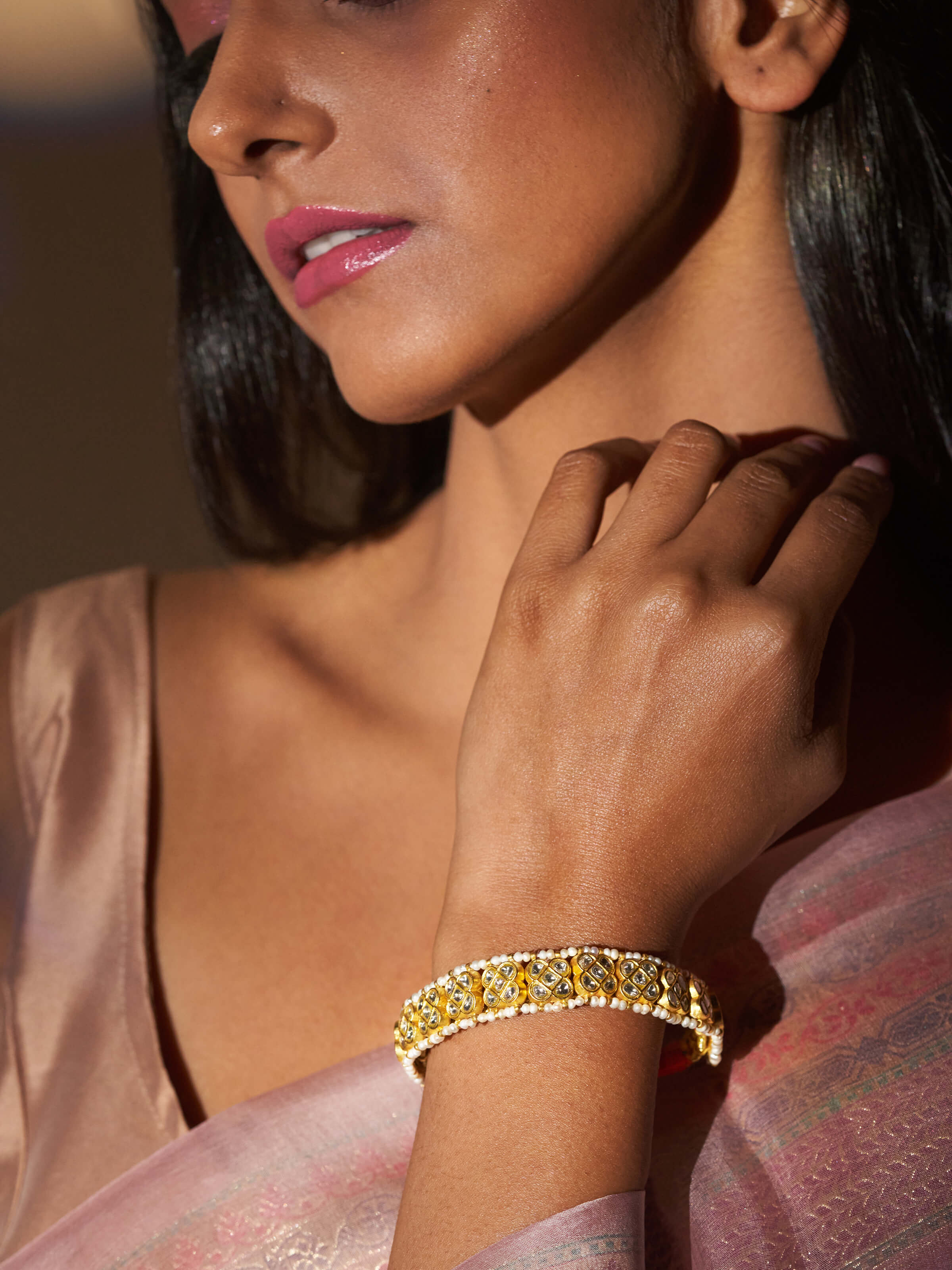 Close-up image highlighting the bracelet’s fine 22K gold texture